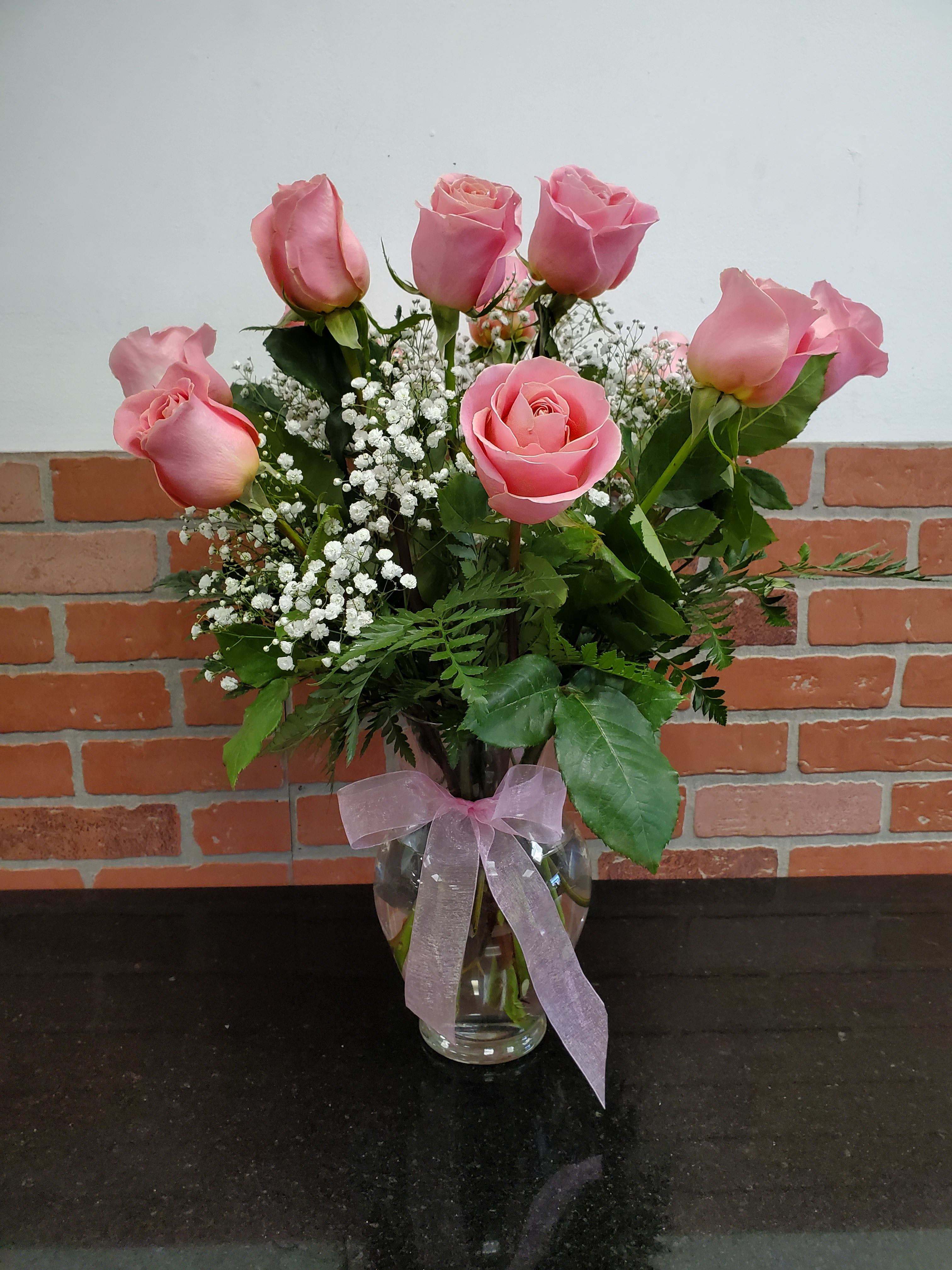 Dozen light pink roses  - A beautiful way to show your love with a soft touch of pink. Standar size 12, deluxe 18 roses and premium 24 roses.