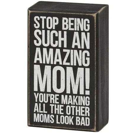 Box Sign Amazing Mom Box Sign Amazing Mom - A classic black and white wooden box sign from for Mother's Day displaying a fun mom-themed sentiment that reads "Stop Being Such An Amazing Mom! You're Making All The Other Moms Look Bad." Funny mom box sign features distressed details with coordinating black color on sides and back. Our Amazing Mom box sign is easy to hang or can free-stand alone. A fun Mother's Day gift that can be easily displayed in any home or work space.