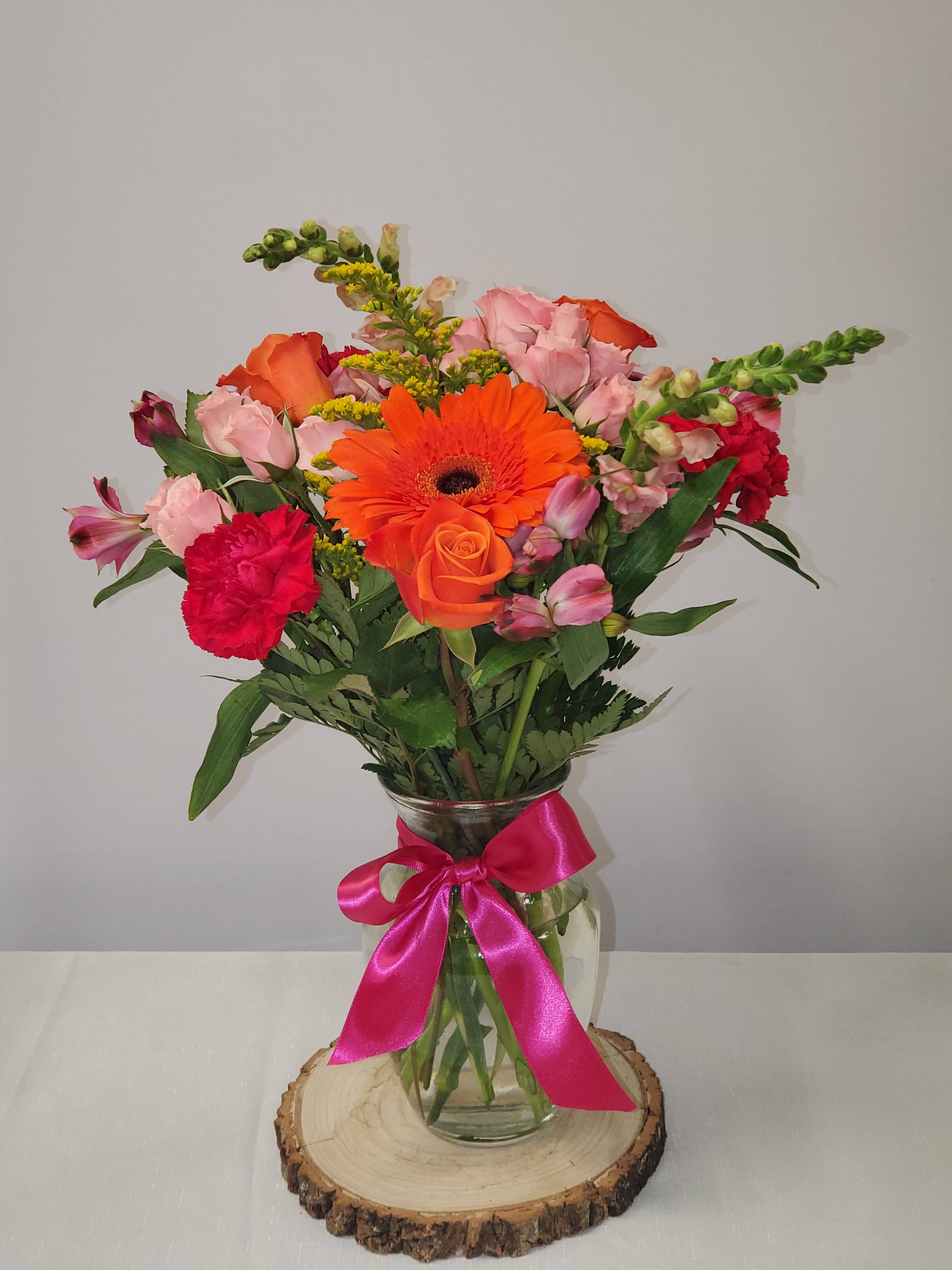 Life of the Party by BloomNation - Celebrate good times with this lively bouquet. The arrangement includes roses, carnations, alstroemeria, stock, aster, and other seasonal blooms.  This is the perfect gift for Mother's Day, Birthday, or Just Because. APPROXIMATE DIMENSIONS: 12&quot; D x 15&quot;H