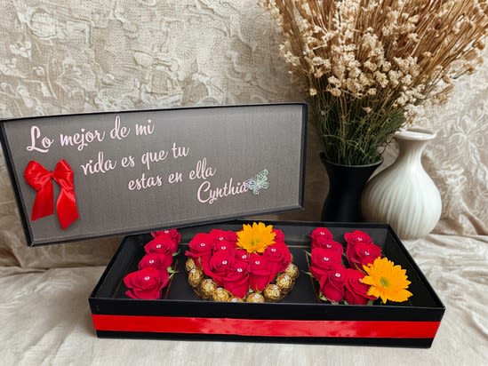 I Love You Box I Love You Box - A sleek rectangular ‘I Love You’ box brimming with premium, long-lasting roses and decadent chocolates, beautifully arranged to indulge the senses. Finished with a satin bow and accompanied by a personalized message, this elegant gift is the ultimate expression of romance and devotion.
