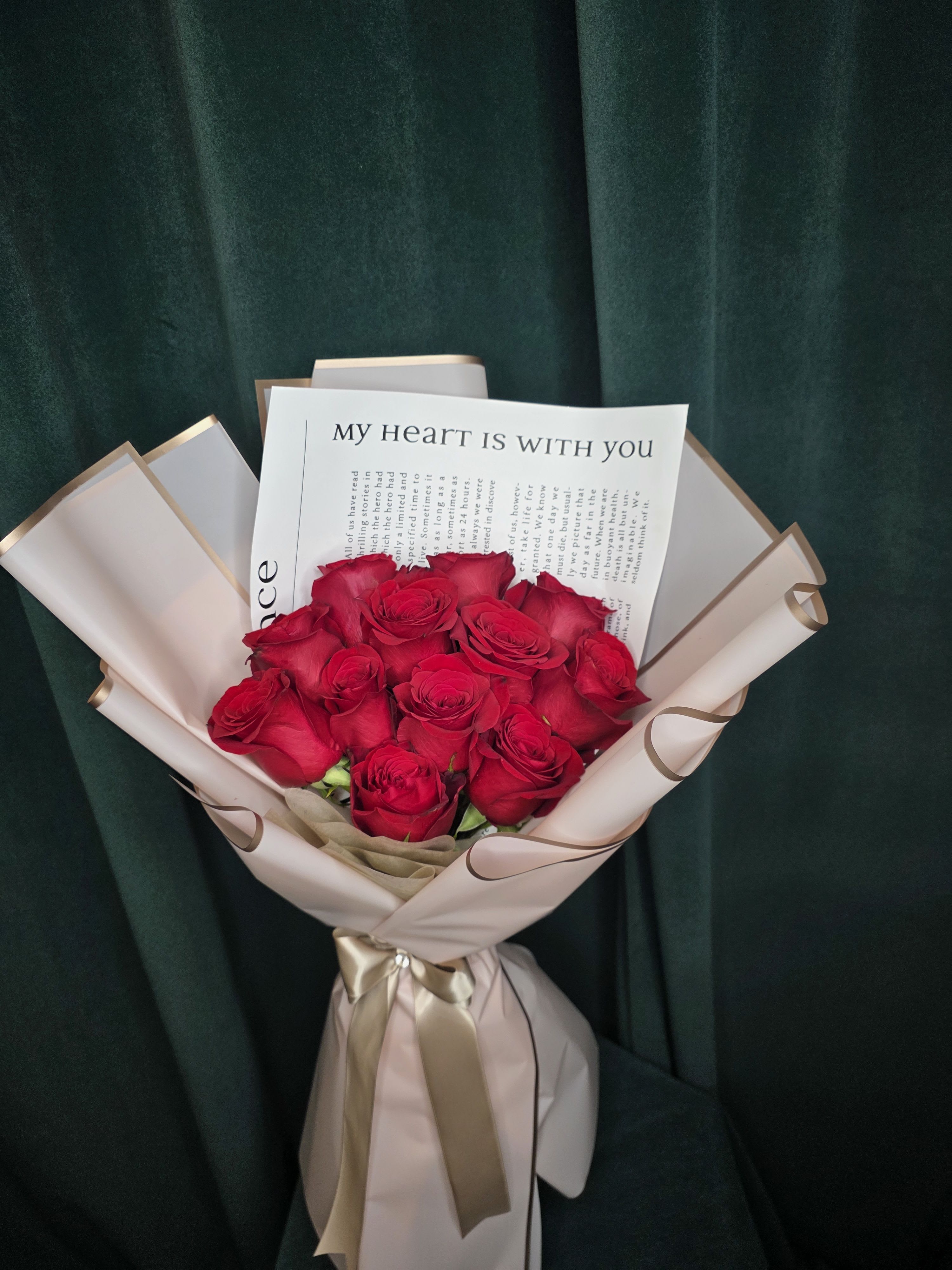 Divine Divine - A graceful Korean-style hand-wrapped bouquet featuring twelve fresh roses, elegantly presented for a timeless look. Simple yet beautiful, this arrangement is perfect for brightening any day, sharing heartfelt thoughts, or making someone feel truly special.
