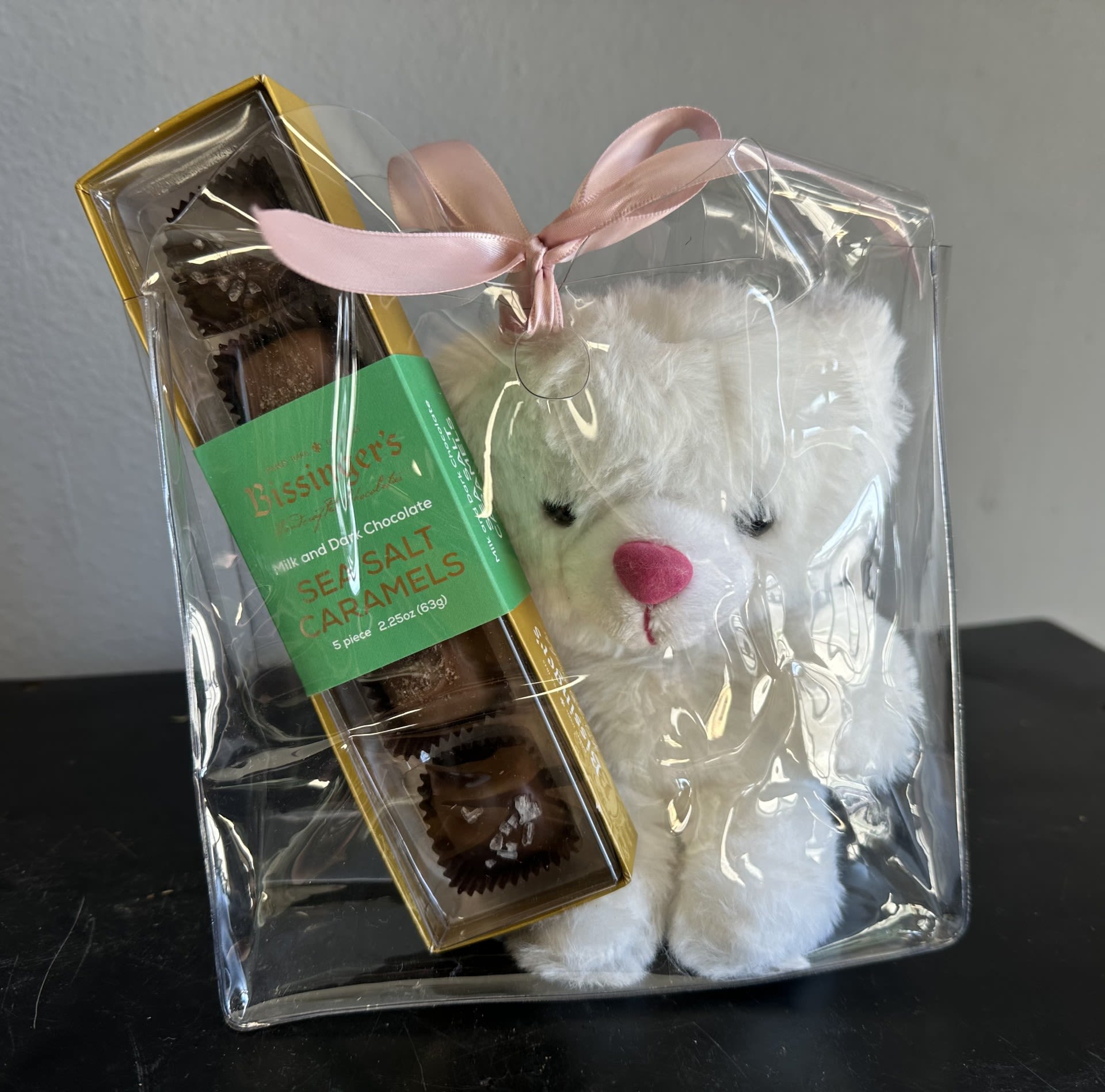 mini white teddy bear + chocolate caramels goodie bag - If you're looking to spice up your flower arrangement, look no further... an adorable mini white teddy bear with Bissinger's milk and dark chocolate sea salt caramels with do just that. It makes for a great addition to our beautiful flower arrangements. Comes tied off in a small clear handbag.
