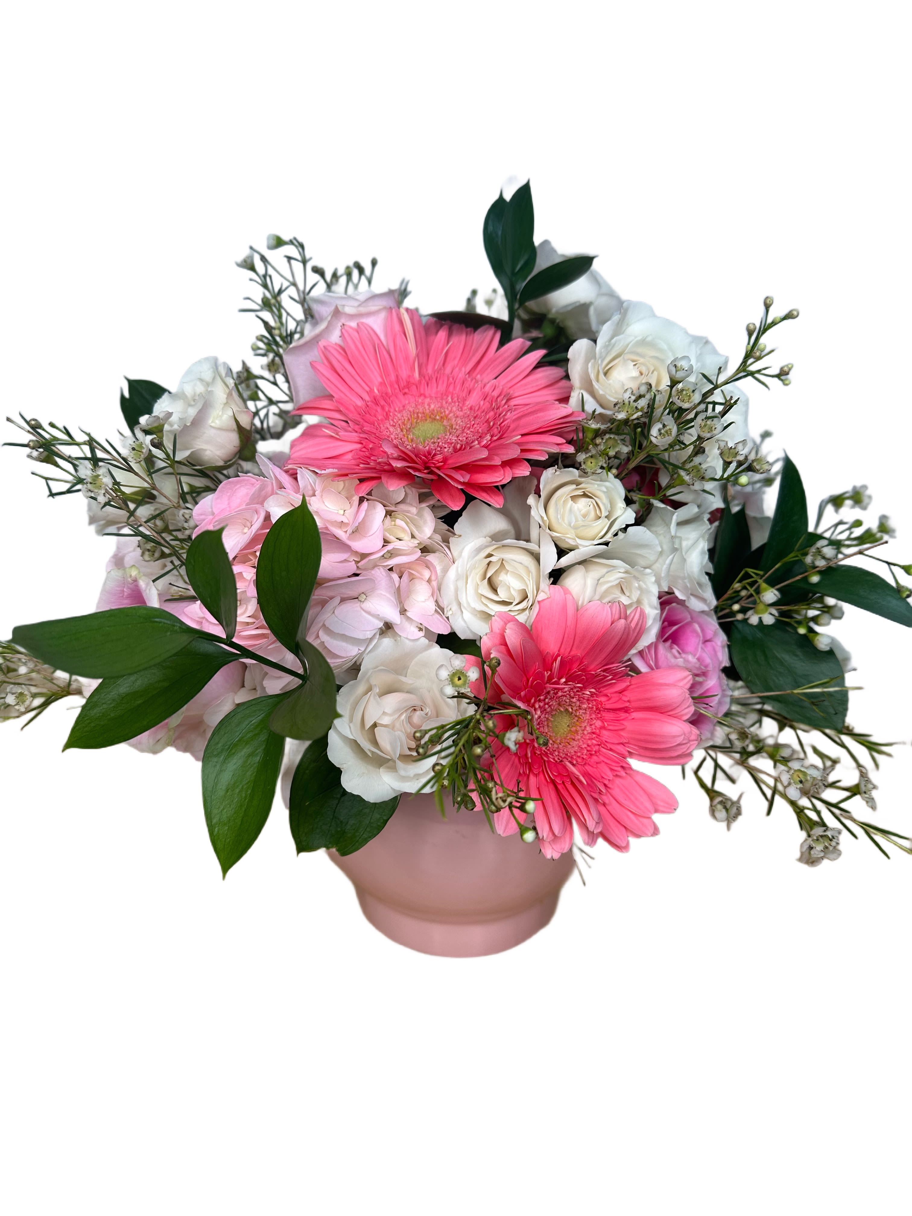 Pink Starburst - A burst of beauty, just like your favorite candy. Pink Starburst is a delightful blend of roses, spray roses, wax flower, hydrangea, and daisies, all in soft shades of pink and white. This arrangement is playful yet elegant, with fluffy textures and cheerful blooms that radiate sweetness and charm.  Perfect for birthdays, baby showers, or just to brighten someone’s day, Pink Starburst feels like a floral treat—fresh, fun, and full of heart.  Soft. Sweet. Sparkling with pink personality.  Vase subject to change