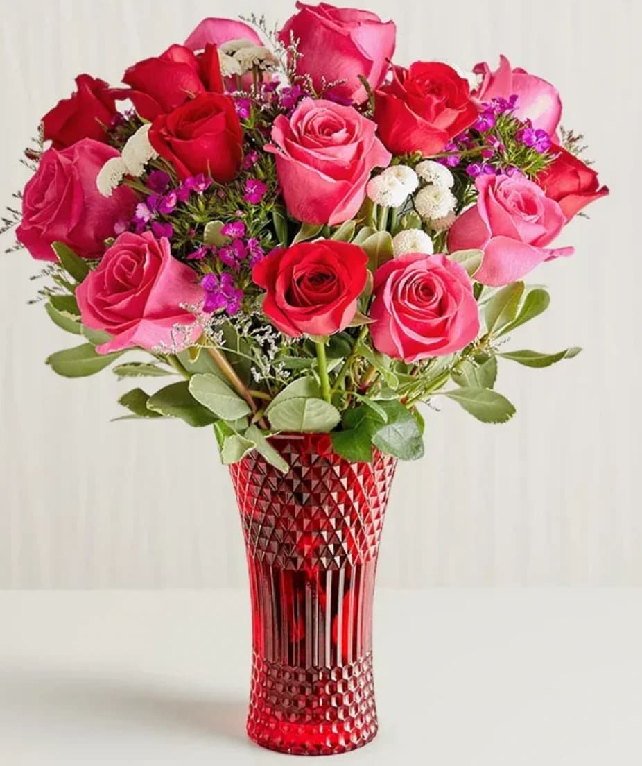 Key to My Heart (exquisite) Key to My Heart (exquisite) - The key to an unforgettable Valentine’s Day. Red, pink, and purple blooms are arranged in our luxurious red vase, creating a statement as vibrant and dazzling as your love. All-around arrangement with red and hot-pink roses; purple dianthus and limoniums; white button poms; accented with greenery Artistically designed in red glass vase; measures 8.75”H x 4.75”Dia Extra-large arrangement measures approximately 20"H x 16"W Large arrangement measures approximately 19"H x 15"W Medium arrangement measures approximately 18"H x 14"W Small arrangement measures approximately 17"H x 13"W Our florists hand-design each arrangement, so colors and varieties may vary due to local availability