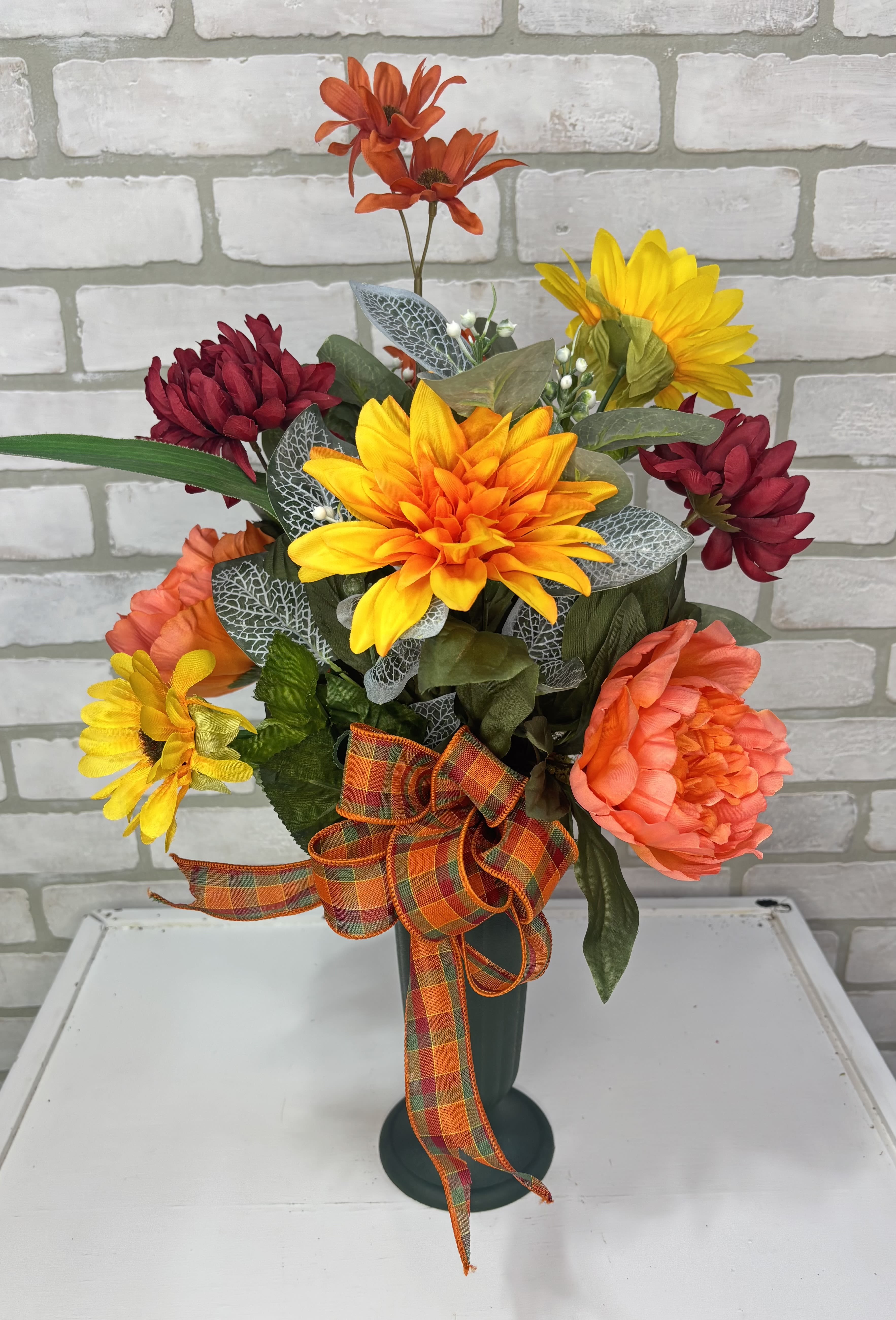 Bright Fall Artificial Silk Cemetery Cone  - A green cone arranged with artificial sunflowers, dalilah's, peonies, and mixed greenery. 