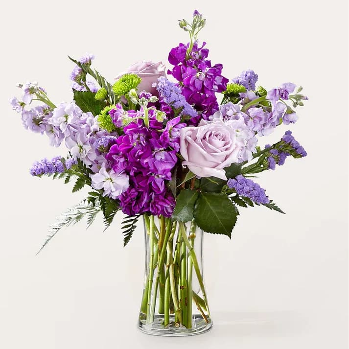 Grapeful Bouquet  - Utilizing the calming yet powerful nature of the color purple, the Grapeful Bouquet is a beautiful way to send well wishes. Details Designed by florists, ready to display. For long–lasting blooms, replace the water daily. We suggest trimming the stems every couple days. Pet Safety Precautions: This bouquet or plant may include flowers and foliage that are known to be toxic to pets. To keep them safe, be sure to keep this arrangement out of your pet's reach.