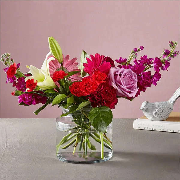 All My Love Bouquet  - Give everything and more to the one who captured your heart. The All My Love Bouquet features refreshing pops of color in the hot pink gerbera daisies, while the crisp lilies in a clear, glass vase are effortlessly timeless and elegant.  Please Note: The bouquet pictured reflects our original design for this product. While we always try to follow the color palette, we may replace stems to deliver the freshest bouquet possible, and we may sometimes need to use a different vase. Details The Deluxe Bouquet is about 15&quot; H x 18&quot; W.