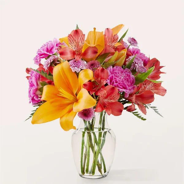 Entranced Bouquet - Your recipient won't be able to take their eyes off these captivating colors of fuschsia, red, and orange.
