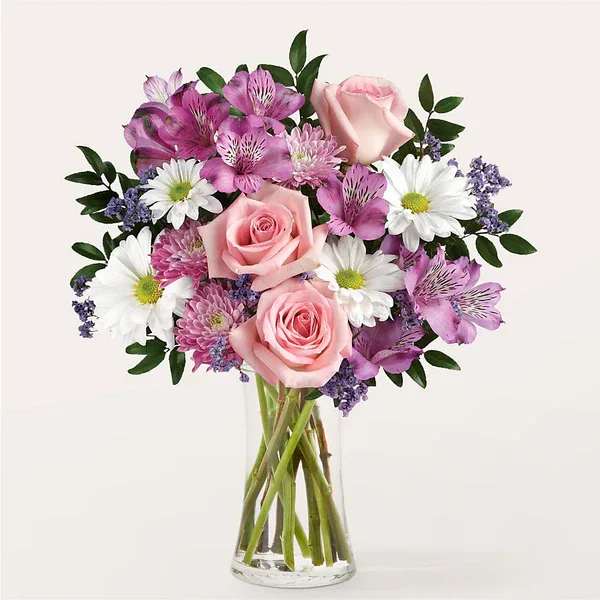 Enchantment Bouquet  - Full of shades of pink and purple, our Enchantment Bouquet is a sweet gesture of magic and wonder. Details Designed by florists, ready to display. For long–lasting blooms, replace the water daily. We suggest trimming the stems every couple days. Pet Safety Precautions: This bouquet or plant may include flowers and foliage that are known to be toxic to pets. To keep them safe, be sure to keep this arrangement out of your pet's reach.