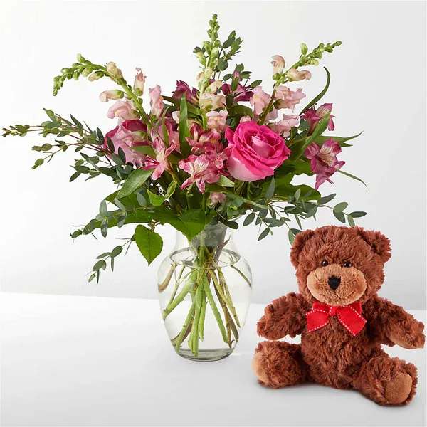 Happily Ever After Bouquet & Bear Set Happily Ever After Bouquet & Bear Set - Show them your love springs eternal. Our enchanting Evermore Bouquet – featuring pink roses, alstroemeria, snapdragons – is coupled with an adorable Plush Bear for a gift set fit for a fairy tale. Details Includes the standard size of our Evermore Bouquet and a plush bear. The Standard Bouquet is approximately 17"H x 17"W. Designed by florists, ready to display. For long–lasting blooms, replace the water daily. We suggest trimming the stems every couple days. Pet Safety Precautions: This bouquet or plant may include flowers and foliage that are known to be toxic to pets. To keep them safe, be sure to keep this arrangement out of your pet's reach.