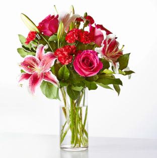 Love at First Sight Bouquet - Swoon over these standout stems in the Love at First Sight Bouquet, featuring the classics like roses, lilies, and carnations, artfully arranged by your local florist.  Details Designed by florists, ready to display. For long–lasting blooms, replace the water daily. We suggest trimming the stems every couple days. Pet Safety Precautions: This bouquet or plant may include flowers and foliage that are known to be toxic to pets. To keep them safe, be sure to keep this arrangement out of your pet's reach.