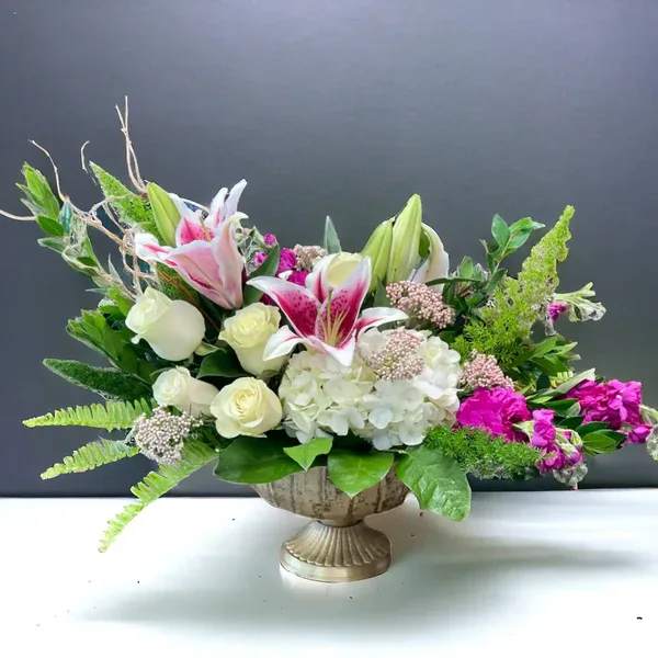The Forever Bouquet The Forever Bouquet - The Forever Bouquet - a luxury mix of premium flowers designed in a beautiful brushed brass compote. Perfectly arranged for that special someone in your life. Styled with emotion, The Forever Bouquet will invoke all of those unspoken emotions. Bloom Details