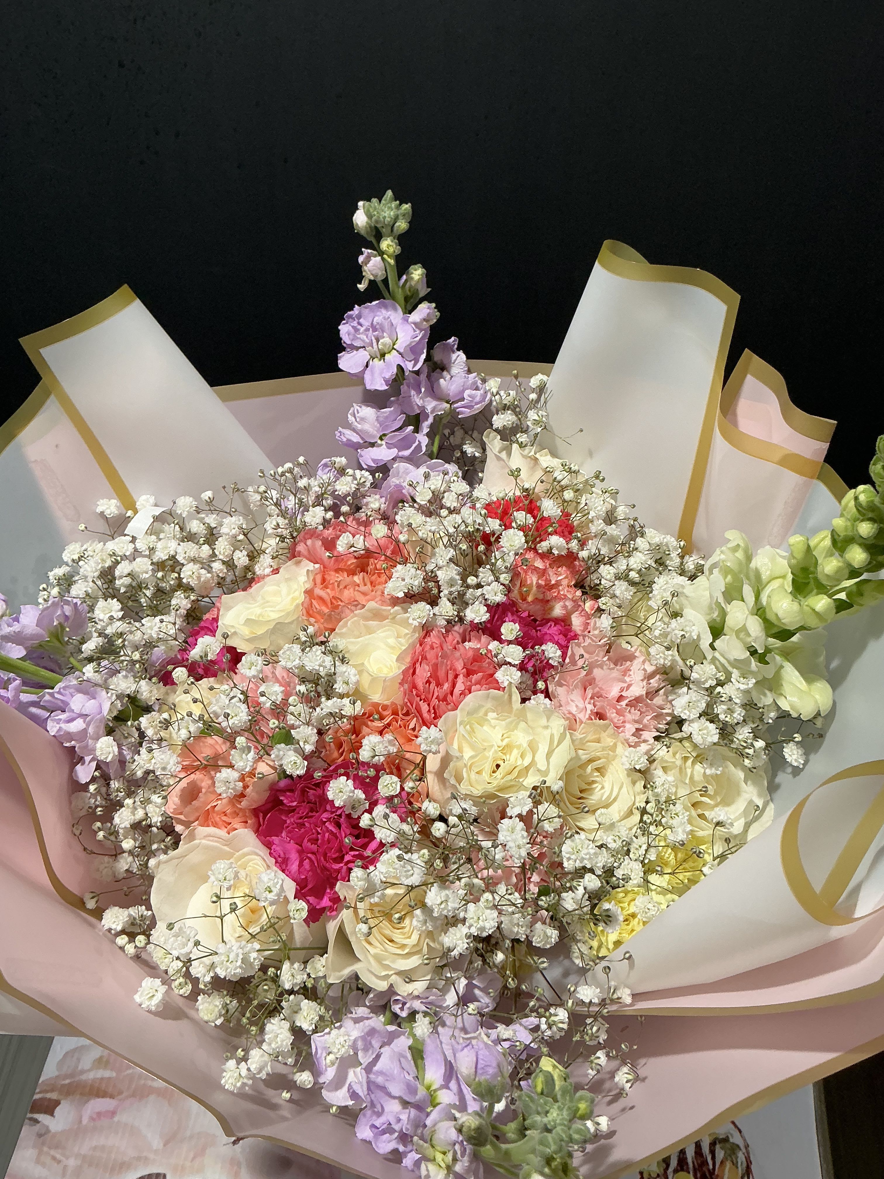 Blooms Combination - This Combination creates a visually appealing and symbolically rich bouquet, suitable for various occasions, including gifts, weddings, or other celebrations.    Roses, carnations, gipsho, stock, exclusive korrean wripping paper  ( no base incluid)