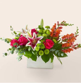 Wild Spirit Bouquet (exquisite) - Give that person in your life a little something that speaks to their wild side. Fun and full florals stand out against accent blooms that takes them out of their comfort zone.  Please Note: The bouquet pictured reflects our original design for this product. While we always try to follow the color palette, we may replace stems to deliver the freshest bouquet possible, and we may sometimes need to use a different vase.  Details The Premium Bouquet is approximately 14&quot;H x 18&quot;W. Designed by florists, ready to display. For long–lasting blooms, add water daily. Pet Safety Precautions: This bouquet or plant may include flowers and foliage that are known to be toxic to pets. To keep them safe, be sure to keep this arrangement out of your pet's reach.