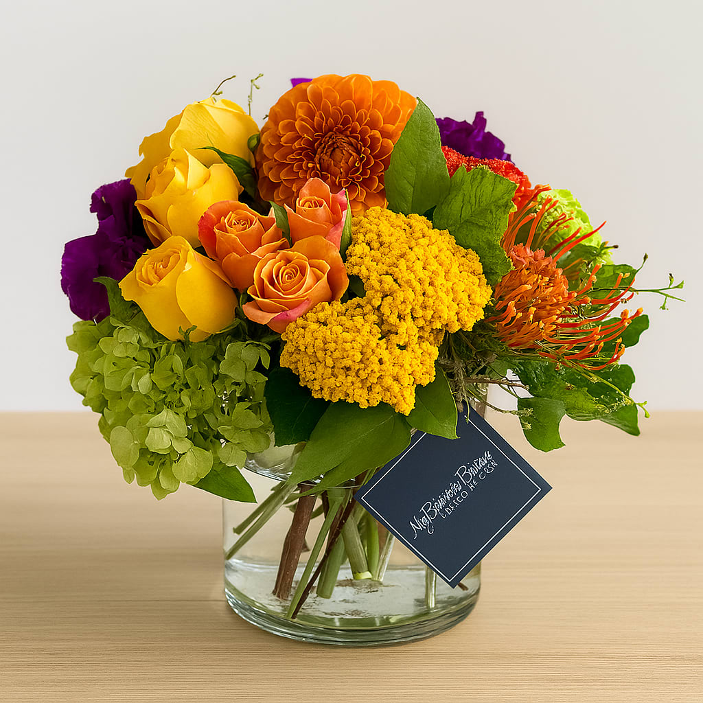 Dreamlover  - Dreamlover Floral Arrangement Ignite the senses with our vibrant Dreamlover arrangement — a joyful blend of golden yellow roses, fiery orange dahlias, lush green hydrangeas, and rich purple accents designed to captivate. Handcrafted in a modern, clear glass vase, this bouquet bursts with color and warmth, making it the perfect gift for celebrations or just because.  Whether you're sending love, gratitude, or a cheerful surprise, Dreamlover delivers beauty and emotion in full bloom. Professionally styled by My Blooming Business, it’s a radiant centerpiece that brightens any space.  Perfect for: celebration flowers, anniversary gifts, get well wishes, thank you gestures, or home décor Key Features:  Fresh premium blooms in vivid hues  Designed in a sleek glass vase  Hand-delivered with care and elegance  Order the Dreamlover bouquet today and let color speak where words fall short.       