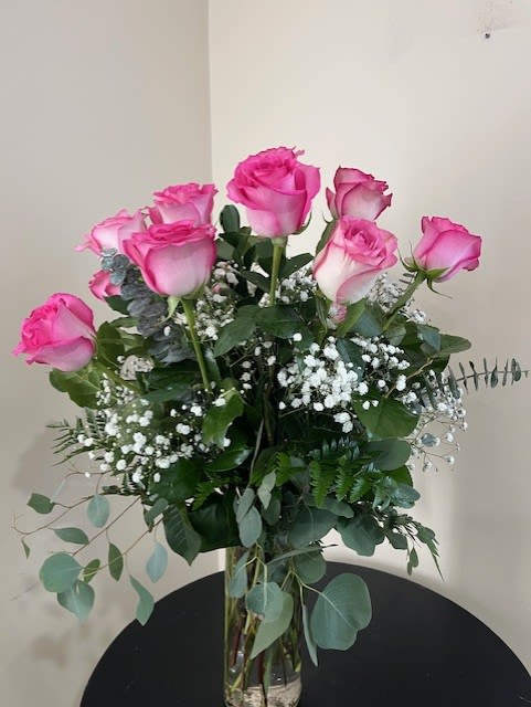 Dozen Long Stemmed Pink Roses by BloomNation™ - These pink roses are cheerful and fun! Dozen Long Stemmed Pink Roses by BloomNation™ is the perfect gift to show your love and appreciation.  APPROXIMATE DIMENSIONS: 25&quot; H X 18&quot; W  
