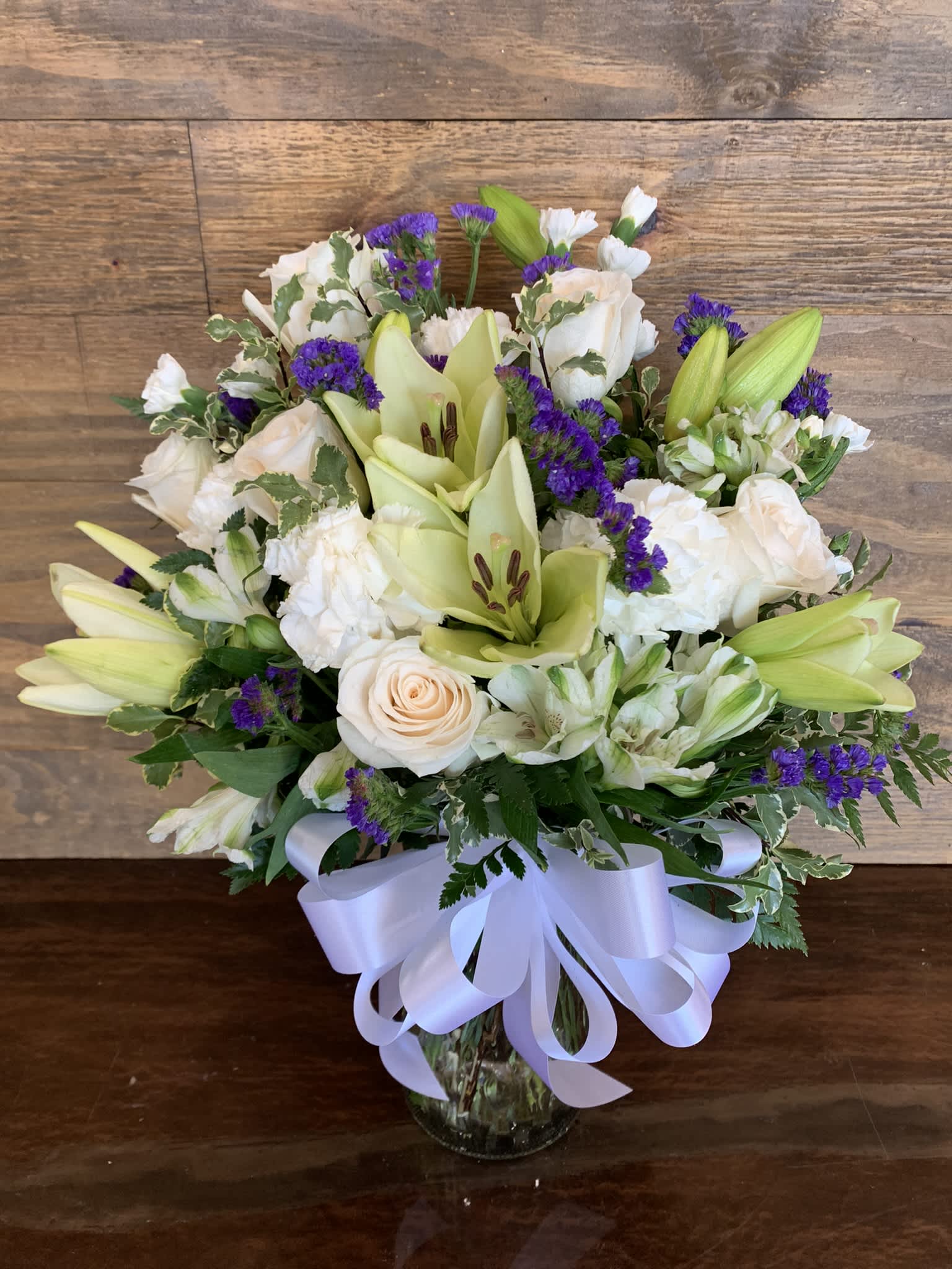 Something Special - All white bouquet with roses, lilies and carnations.