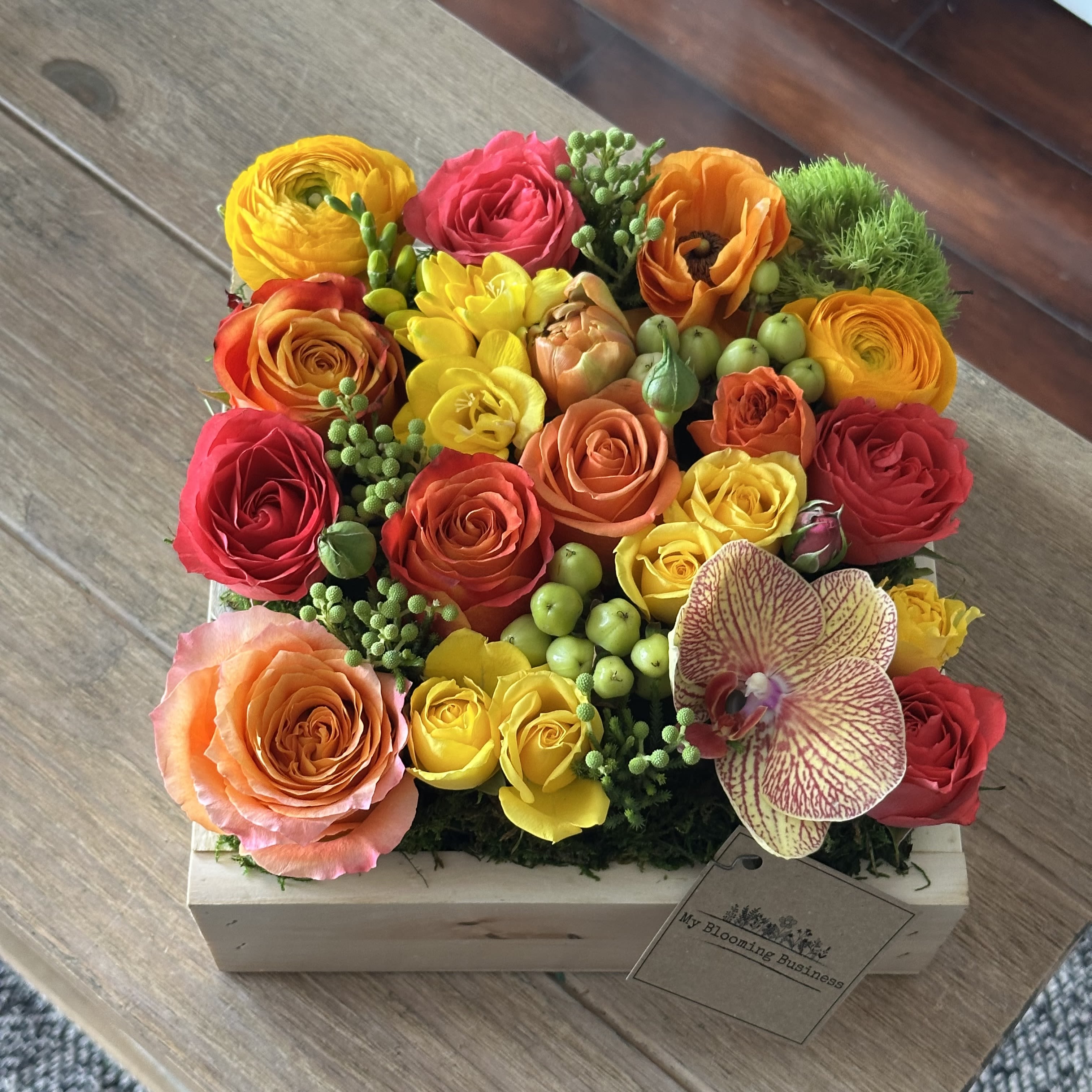 Spring Box  - Spring is here! and our Spring Box is a wood box filled with spring seasonal florals that are bold, colorful and ready to make someone smile. 