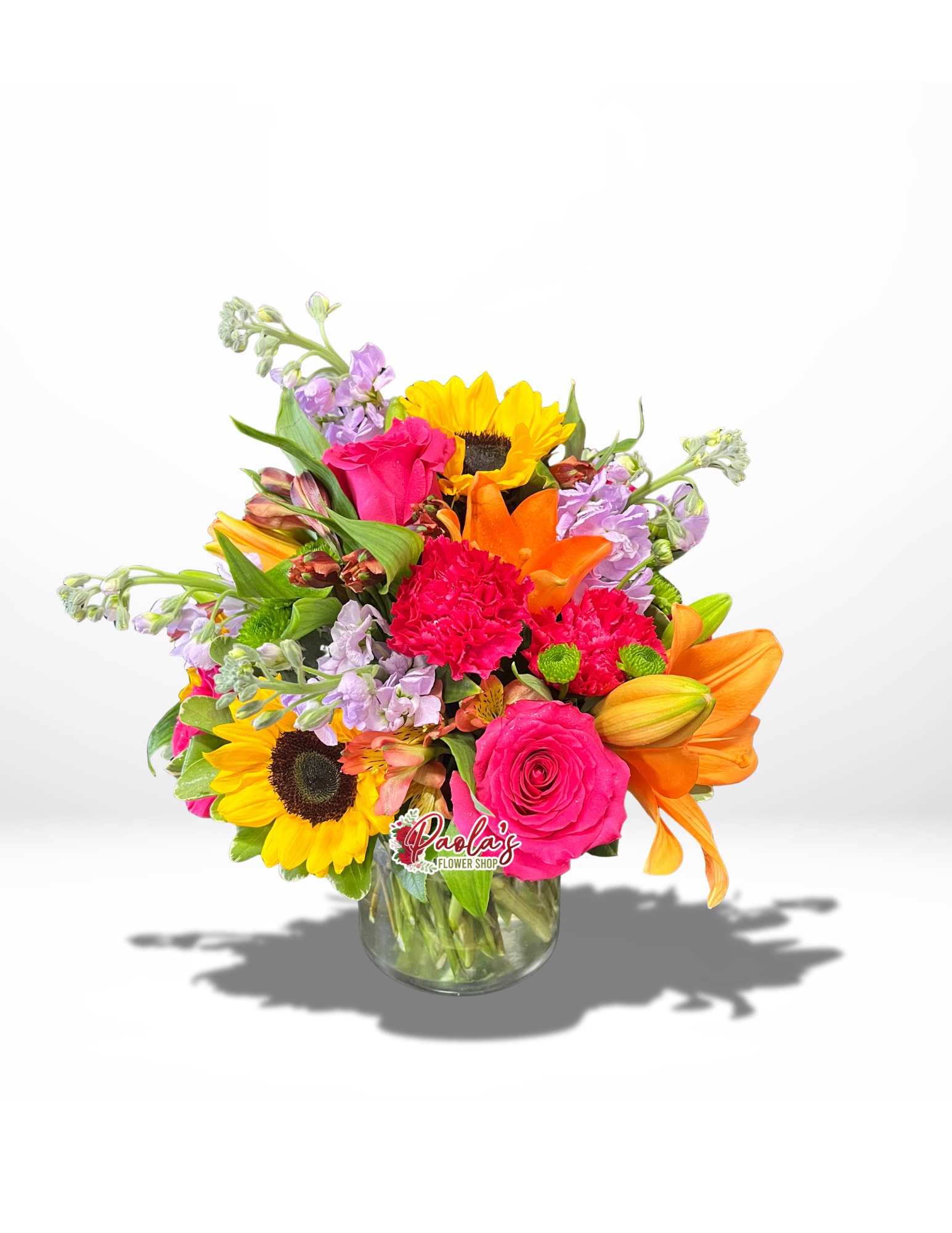 Absolutely Blossom-tastic! - This vase arrangement is guaranteed to captivate anyone's attention! It features a delightful array of blooms, with the sunflowers stealing the spotlight.