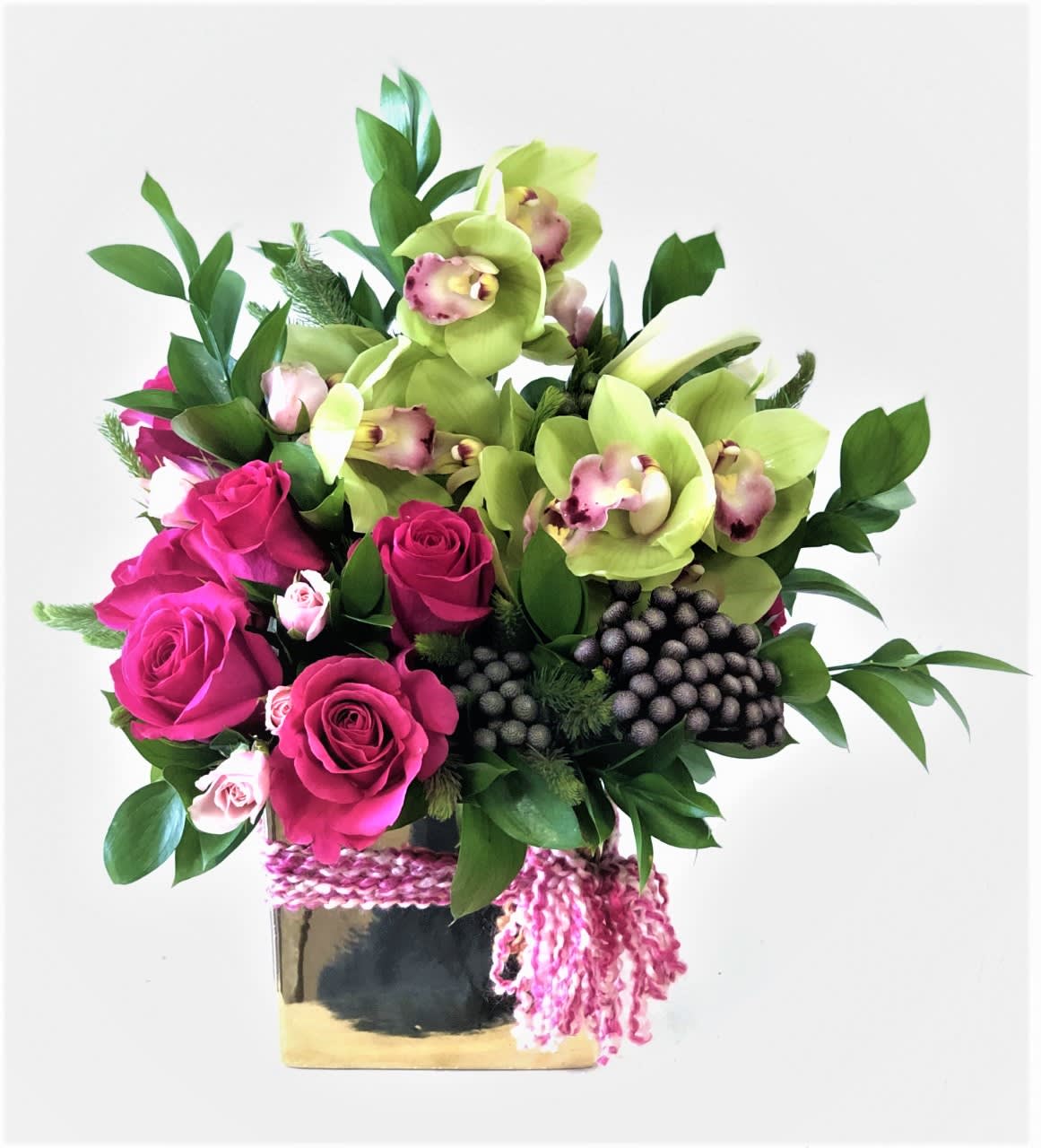 Sienna Lakes Classy Sienna Lakes Classy - Cymbidiums are the BAM! Our favorite flower is combined with Roses and Brunia in a gold vase. This one is special!! Some advance notice may be required to source materials. Interested?