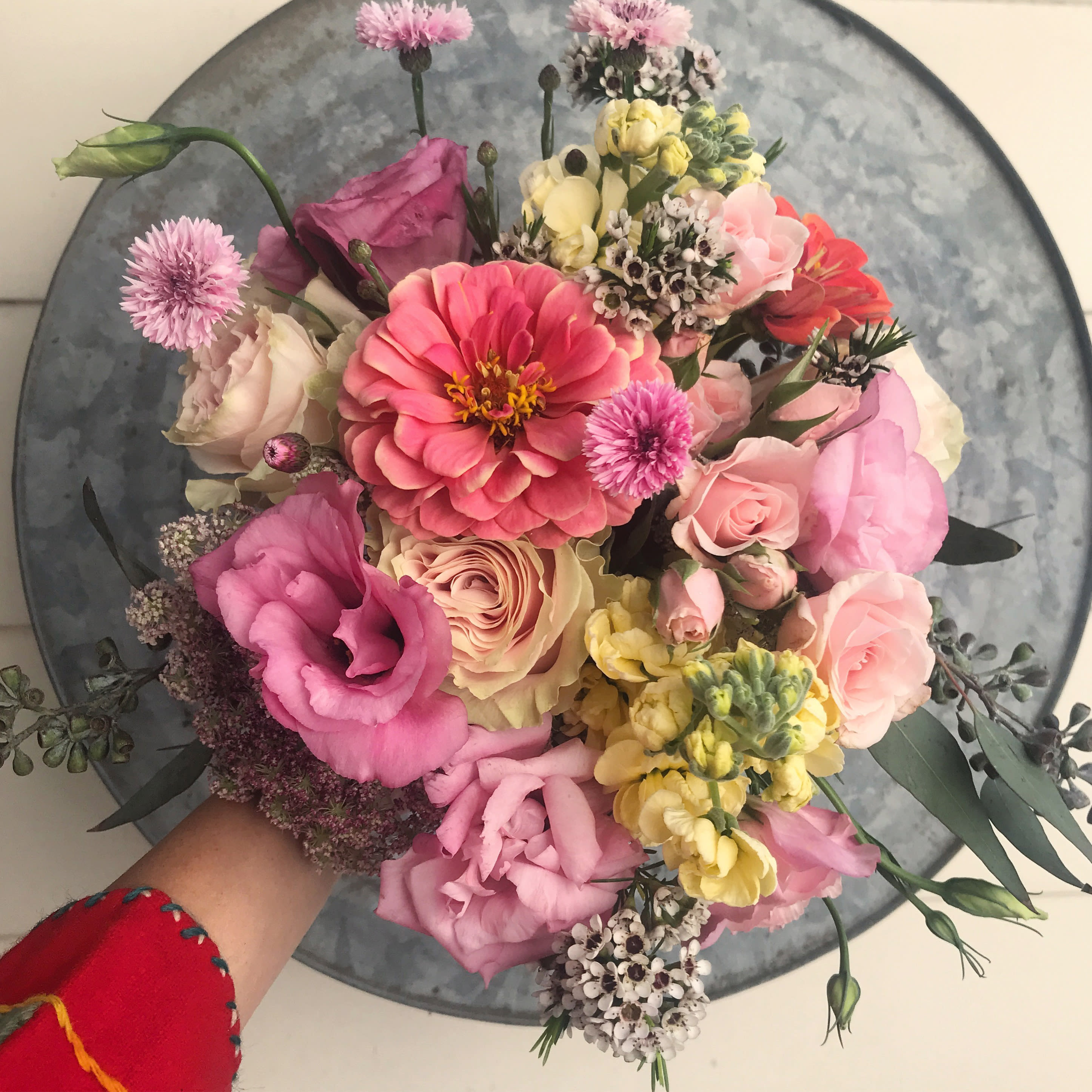 Fifi bouquet - The prettiest pastels in happy springtime nuances in this gorgeous bouquet with a garden like feel to it. Stock, zinnia (or ranunculus), roses, lissianthus and wax flowers adorn this lovely hand tied bouquet, that is always made with a little xtra pretty detail. The bouquet is wrapped in silk paper and beautiful ribbon with pretty wrapping details. If you wish, you can add a vase to the order, and we will arrange  the bouquet beautifully in the clear cylinder vase. Blomst LA only uses fresh, high quality flowers, all carefully selected every day to fit your flower order. We offer a personal hand delivery by our own delivery staff and guarantee the flowers will look perfect, when they arrive. We deliver in Glendale, Pasadena, Eagle Rock, Hollywood, Burbank, Beverly Hills - and everywhere else in Greater Los Angeles.