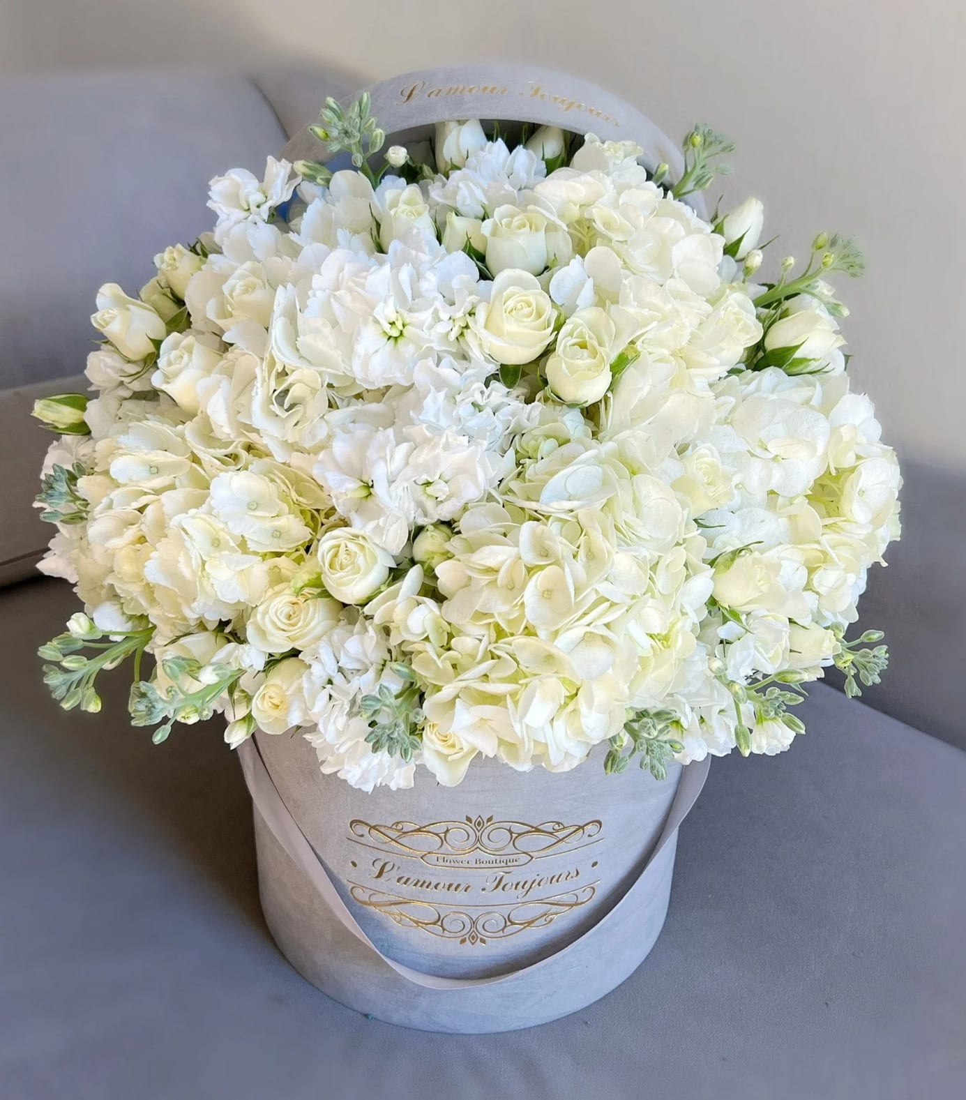 White Spring Mix Signature Box White Spring Mix Signature Box - Mix of luxurious spring flowers in our Signature Grey Velvet Box