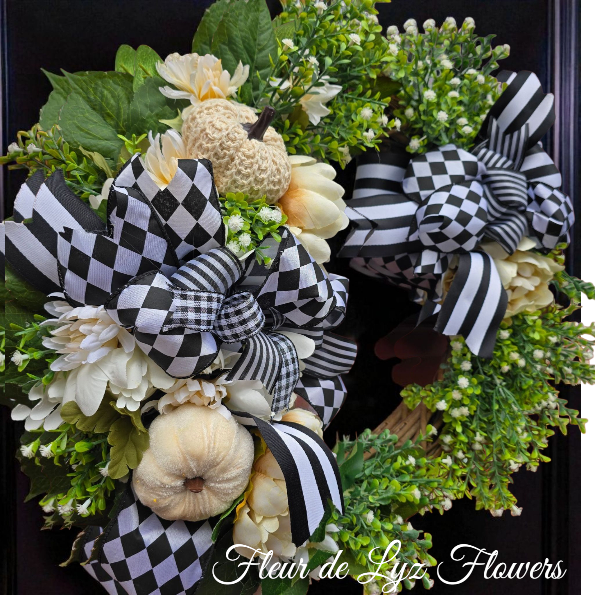Autumn in Check Autumn in Check - A charming blend of farm house elegance and festive Fall flair. Creamy faux pumpkins,soft ivory blooms, and luscious greenery are artfully arranged along side bold black-and - white checkered ribbons