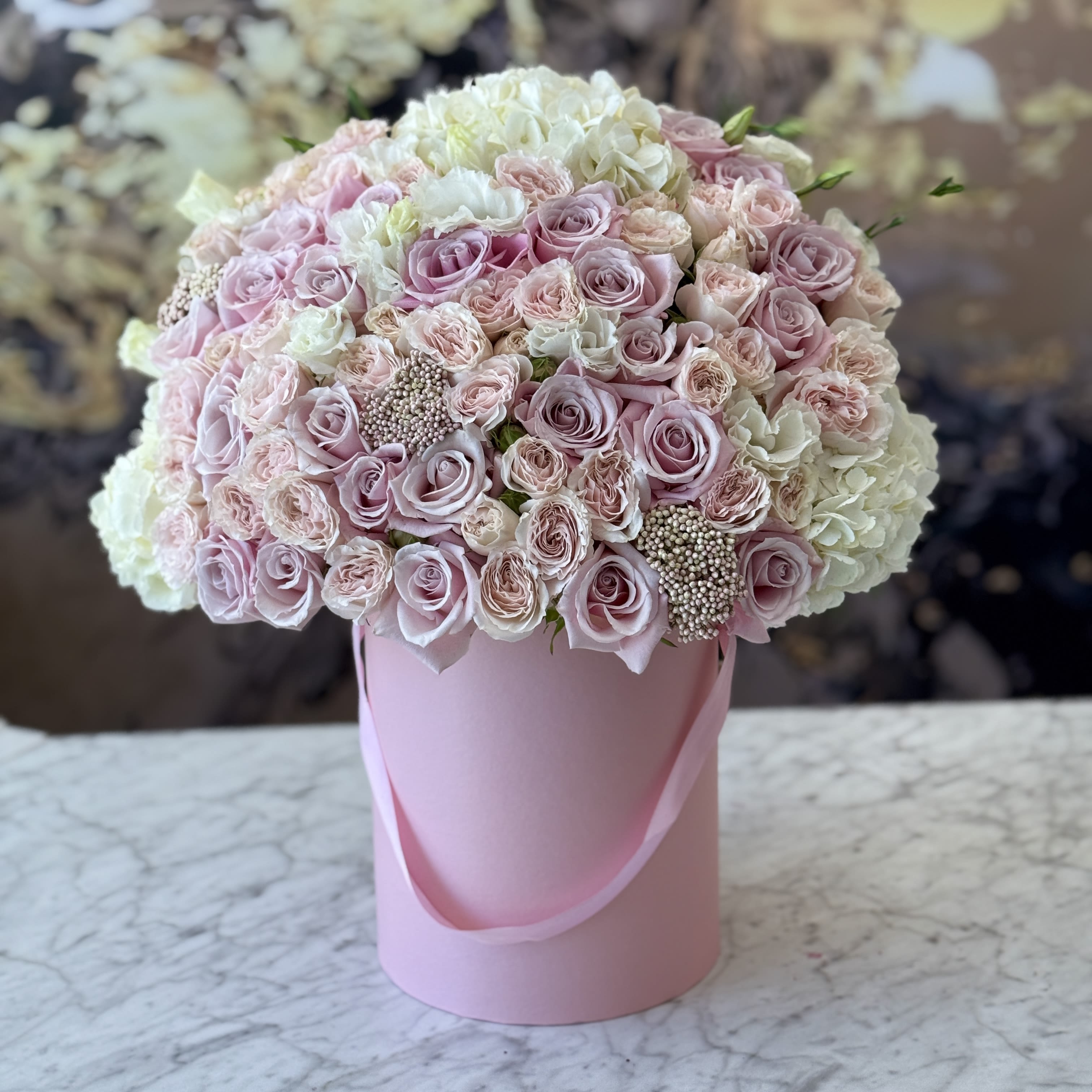 Ballerina Ballerina - Brighten any space with our Elegant Flower Box Arrangement! Bursting with vibrant blooms, this stunning display combines seasonal favorites with lush fillers. Housed in a chic, reusable container, it makes a perfect centerpiece for any occasion be it a gift or a treat for yourself. Elevate your decor with this captivating arrangement that brings joy and sophistication to your home or office. Order yours today and let the beauty of flowers inspire you!