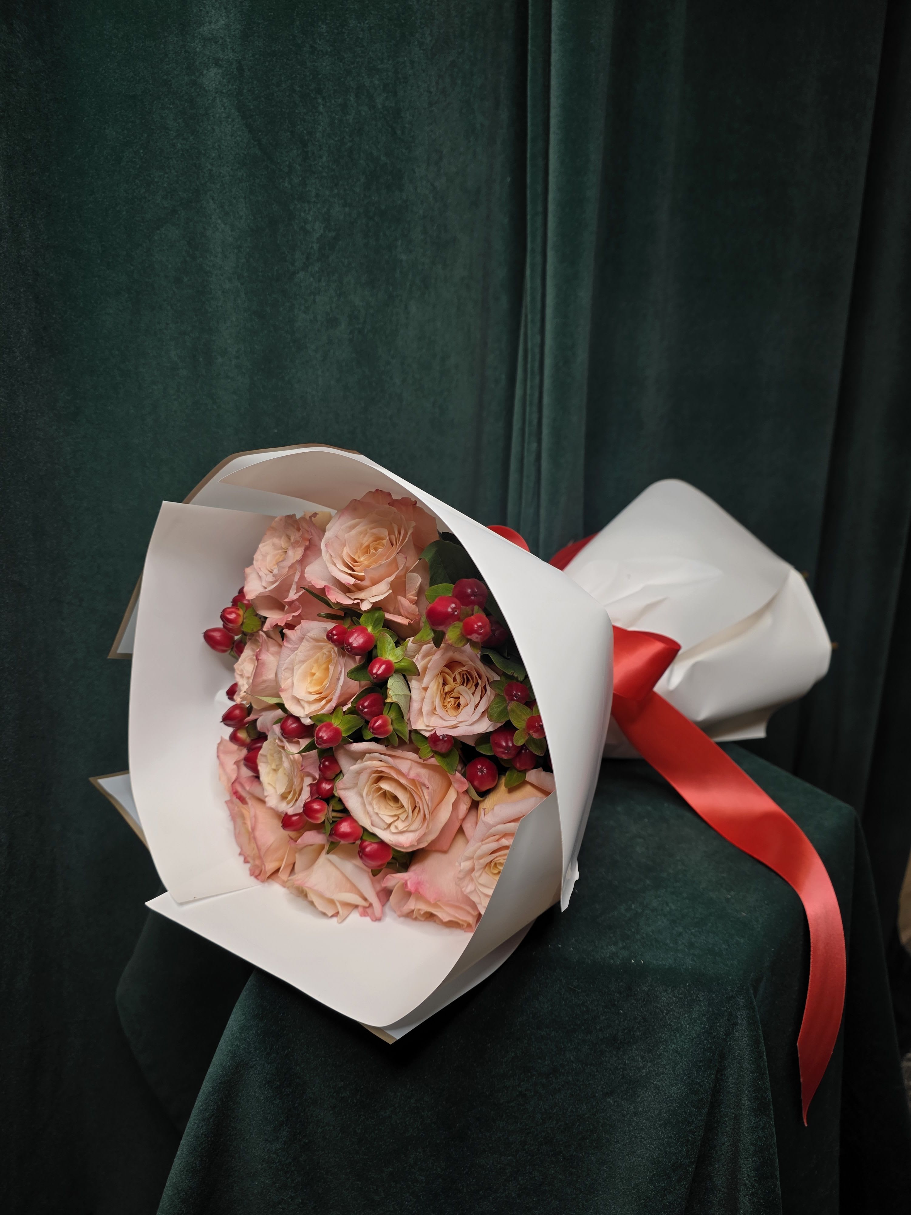 Berry Peachy Berry Peachy - Soft peach roses paired with vibrant hypericum berries, wrapped in chic Korean-style paper. A graceful, fruitful bouquet perfect for any occasion.
