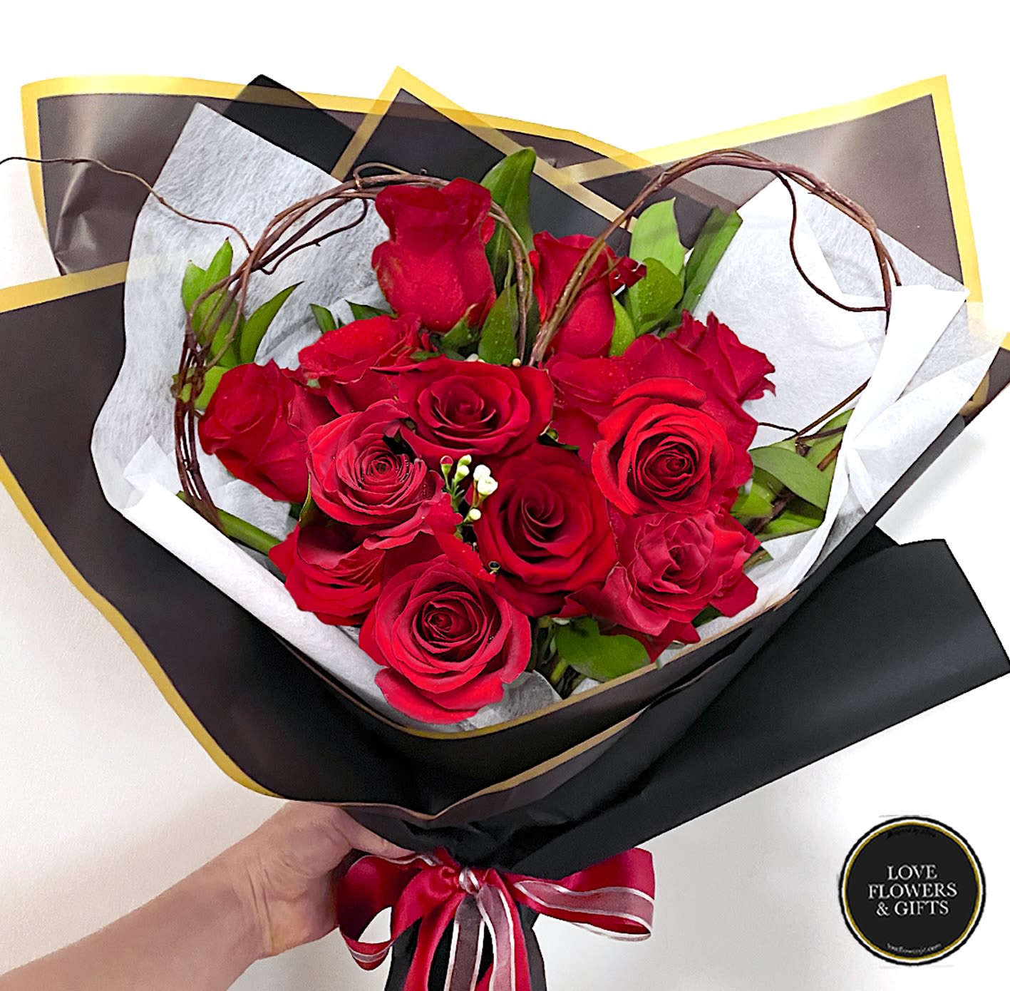 Classic Red Roses (Wrapped Bouquet) Classic Red Roses (Wrapped Bouquet) - Red roses hugged by a heart-shaped natural branches, wrapped in high quliaty floral paper with satin ribbon, perfect for Valentines!