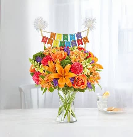 Vibrant Birthday Medley - Our vibrant bouquet is filled with a mix of blooms in cheerful pops of orange, yellow and hot pink with lush greenery and filler. A happy birthday banner accents beautifully.
