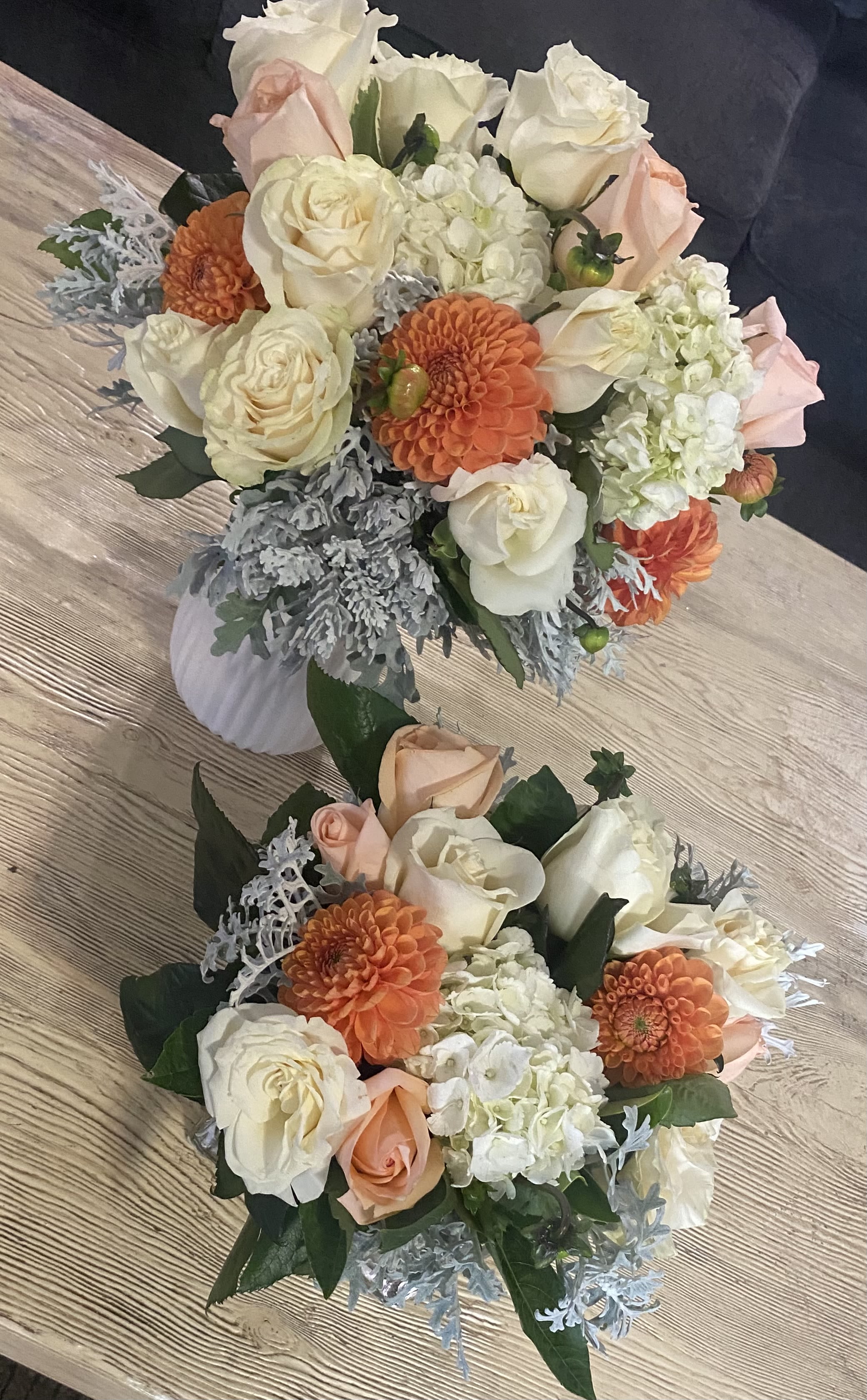 ELEGANT CENTERPIECE SET ELEGANT CENTERPIECE SET - Centerpiece Array- White, Peach and Peach flowers. This striking set of lovely blooms ,featuring roses and dahlias ,is the perfect expression joy. Containers may vary.