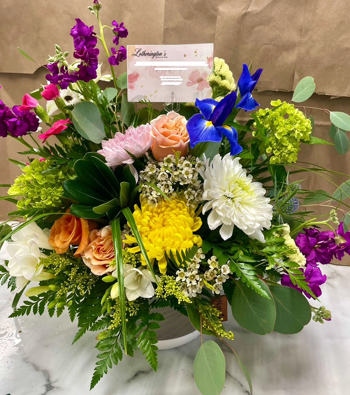 Brilliance by Lotherington's Brilliance by Lotherington's - For the color lover in your life! Featuring 6 different types of flowers, this arrangement is a bright beauty. Send it to celebrate the summer season or for birthdays. Approximate Dimensions: 14"D x 11"H