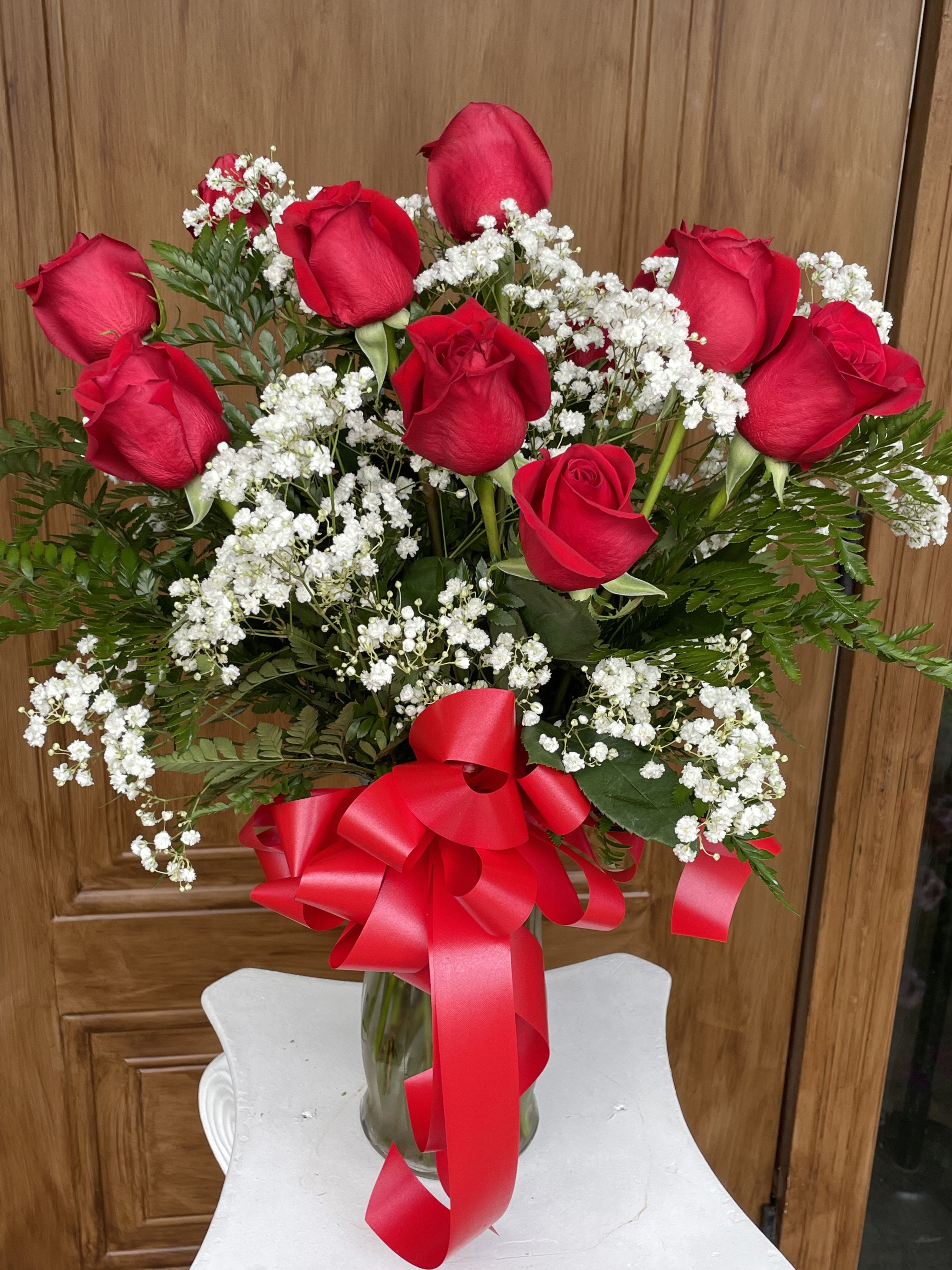 Dozen Long Stemmed Red Roses by Lotherington's - These dozen red roses are the classic romantic gift! Perfect for Valentine's Day or an Anniversary or with you in mind.  APPROXIMATE DIMENSIONS: 25&quot; H X 18&quot; W