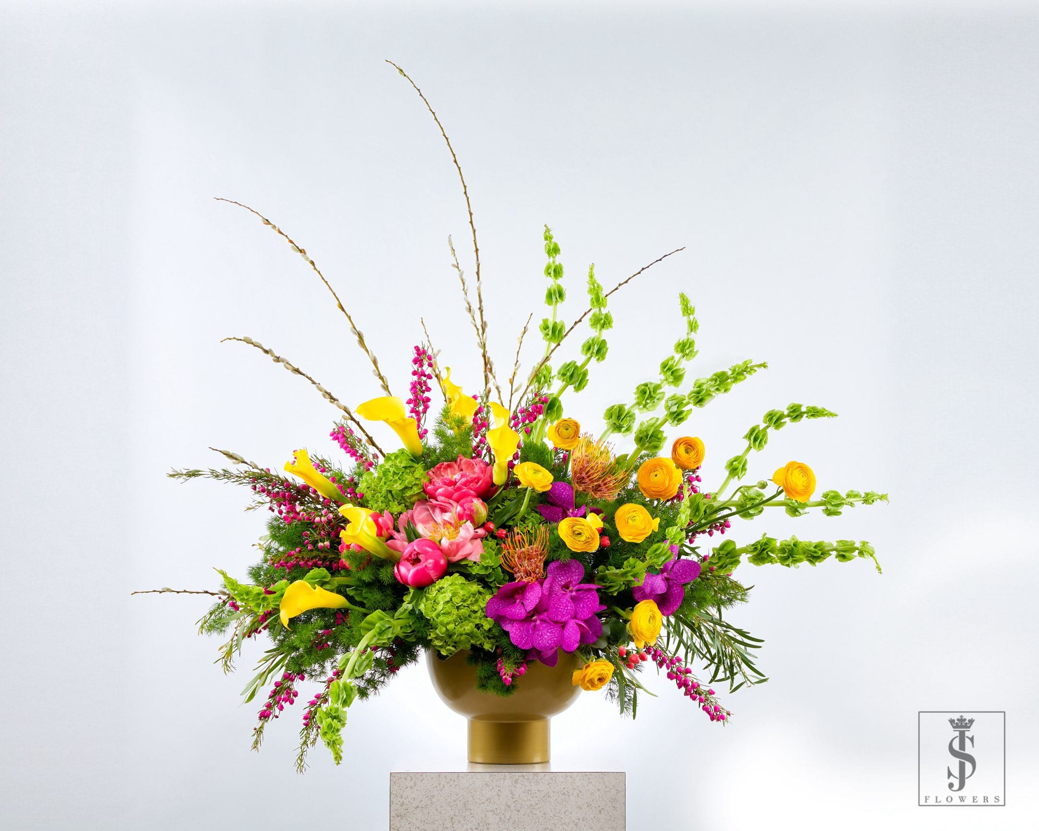 Starburst Spectacular - Starburst Spectacular  Bold, joyful, and impossible to ignore, Starburst Spectacular explodes with the vibrant energy of hot pink, sunny yellow, fresh green, and vivid orange blooms. Each stem is selected for its striking color and lush texture, creating a dynamic arrangement that radiates celebration from every angle.  Perfect for birthdays, milestone events, or any moment worth making unforgettable, this design is pure happiness in floral form.  Ideal for: parties, congratulations, or brightening a space with color and style.
