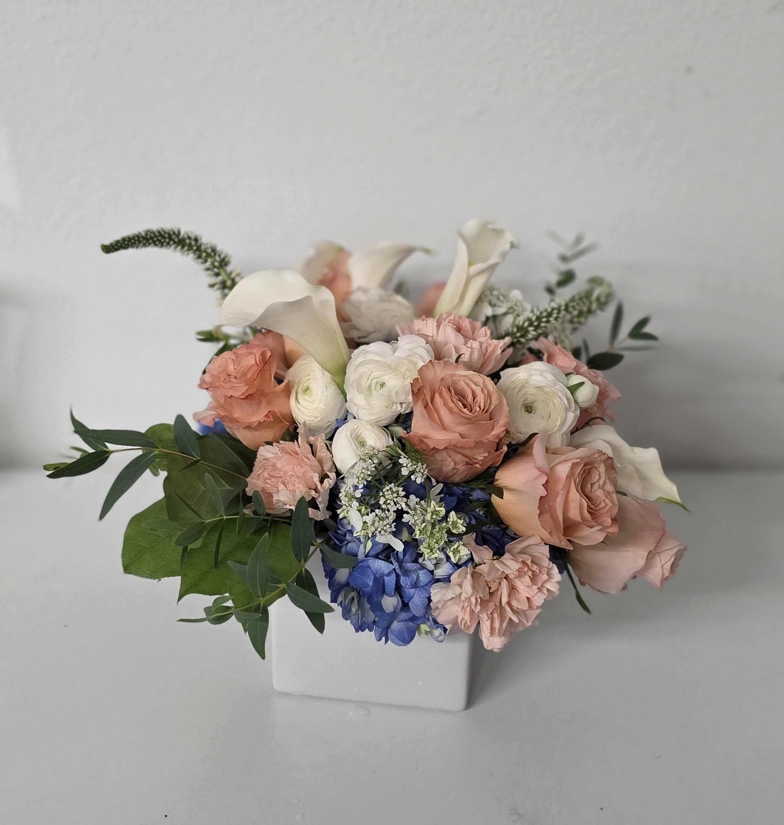 Catherine's Peaches - Catherine's Peaches consists of peach roses, hydrangea, stock, and seasonal greenery. 