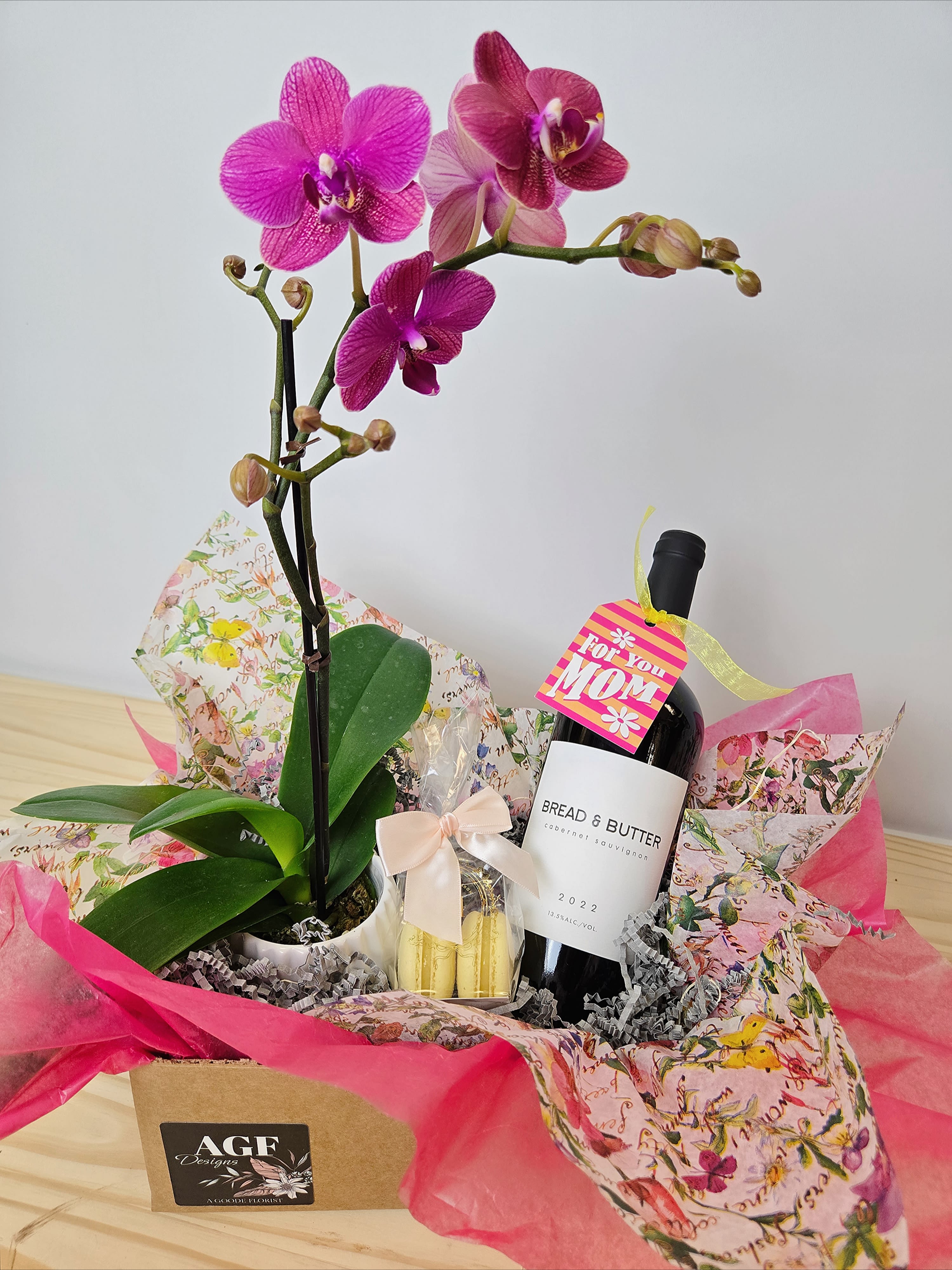 Cabernet & Macaron Box Cabernet & Macaron Box - Small live orchid plant, Bread & Butter Cabernet Sauvignon & Miette Macarons "flavor of the week"