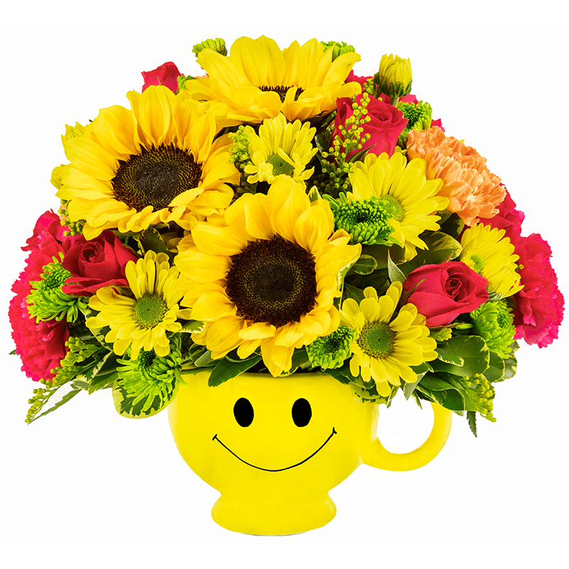 Sunny Smiles Mug - When you're looking to make someone smile, this happy face mug of roses, sunflowers, carnations, and daisies is tops. Sure to cheer up everyone from a beloved wife to a busy boss, these are also great flowers for kids. Yellow roses, sunflowers, carnations, and daisy spray chrysanthemums are delivered in a yellow happy face, Be Happy mug.