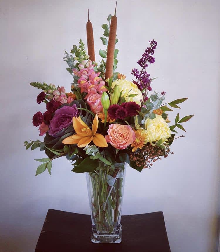 Seasons Harvest - A large, traditional design of the seasons best colors and textural elements filled with roses, snaps, chrysanthemums, cat tails and more.