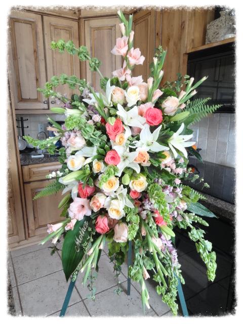 Celestial Bloom - A stunning tribute full of fresh soft pastels make up this beautiful easel design. Measures approximately 33&quot; tall and 26&quot; wide. A 60&quot; easel is included. 