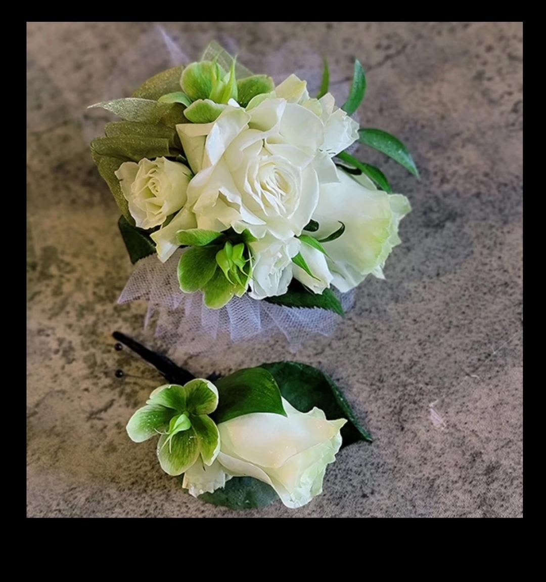 Green and White Corsage and Boutonniere Set Green and White Corsage and Boutonniere Set - A dainty set with white spray roses and green hellebores.
