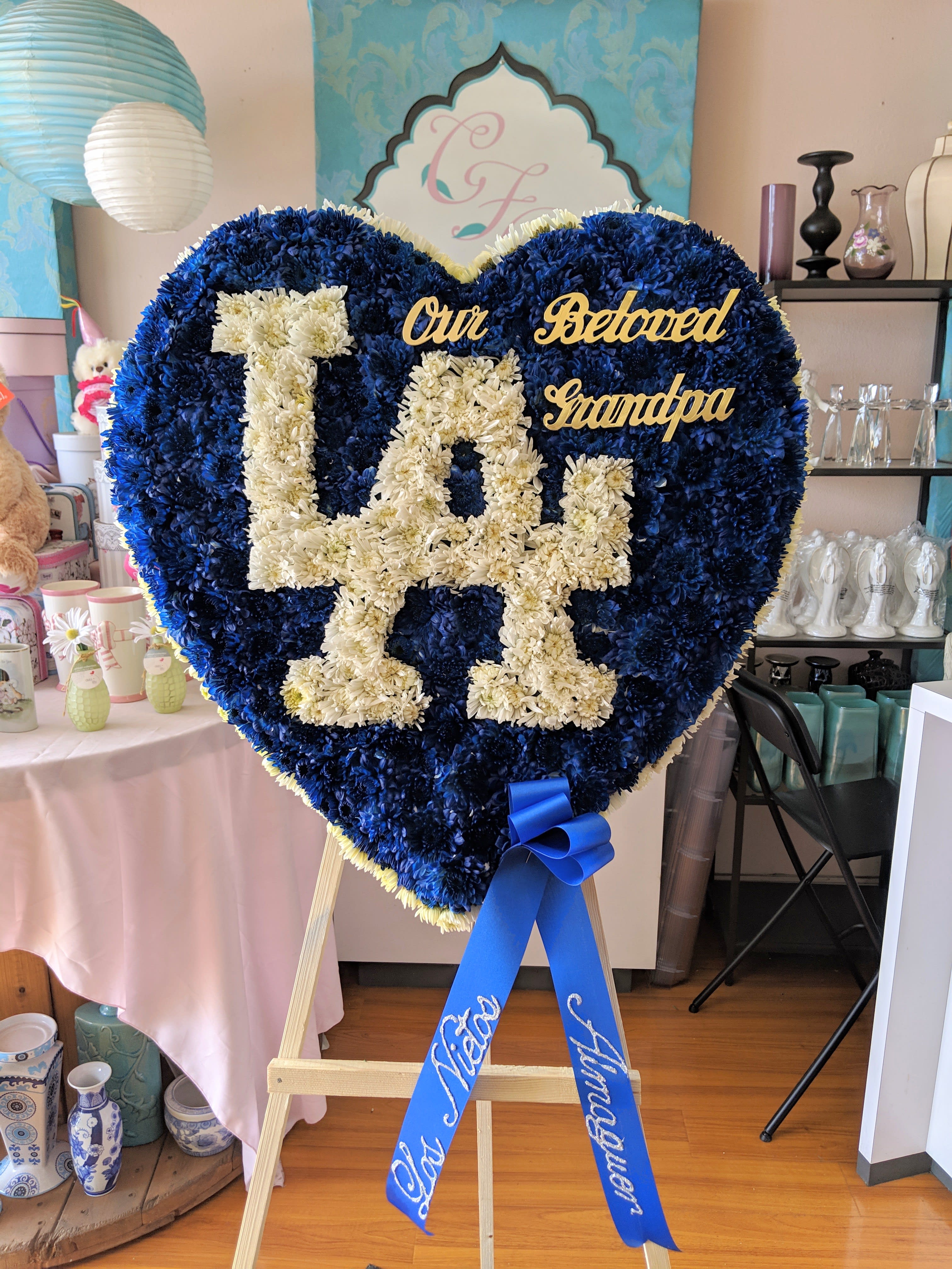 LA Dodger Heart - For the Dodger lovers, make sure you celebrate them in this special way. L.A. Dodger's heart sends them your perfect message of love for them and what they loved so much. Heart size is approximately 26&quot;x26&quot;. For a custom banner, please add by searching &quot;Sympathy Banner&quot;.