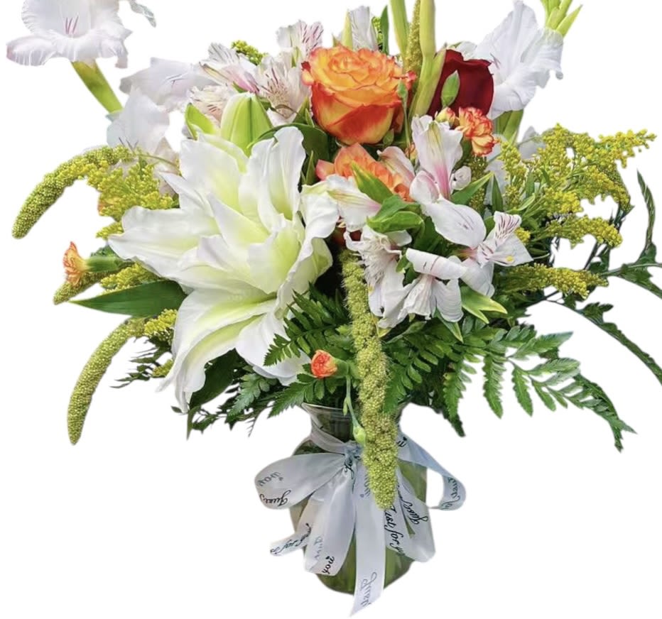 Sunset Melody - A vibrant celebration of color and elegance. Sunset Melody features radiant orange roses, graceful white lilies, delicate alstroemeria, and seasonal blooms in warm golden tones. This bouquet blends freshness and warmth, making it the perfect choice to convey joy, gratitude, and heartfelt wishes.