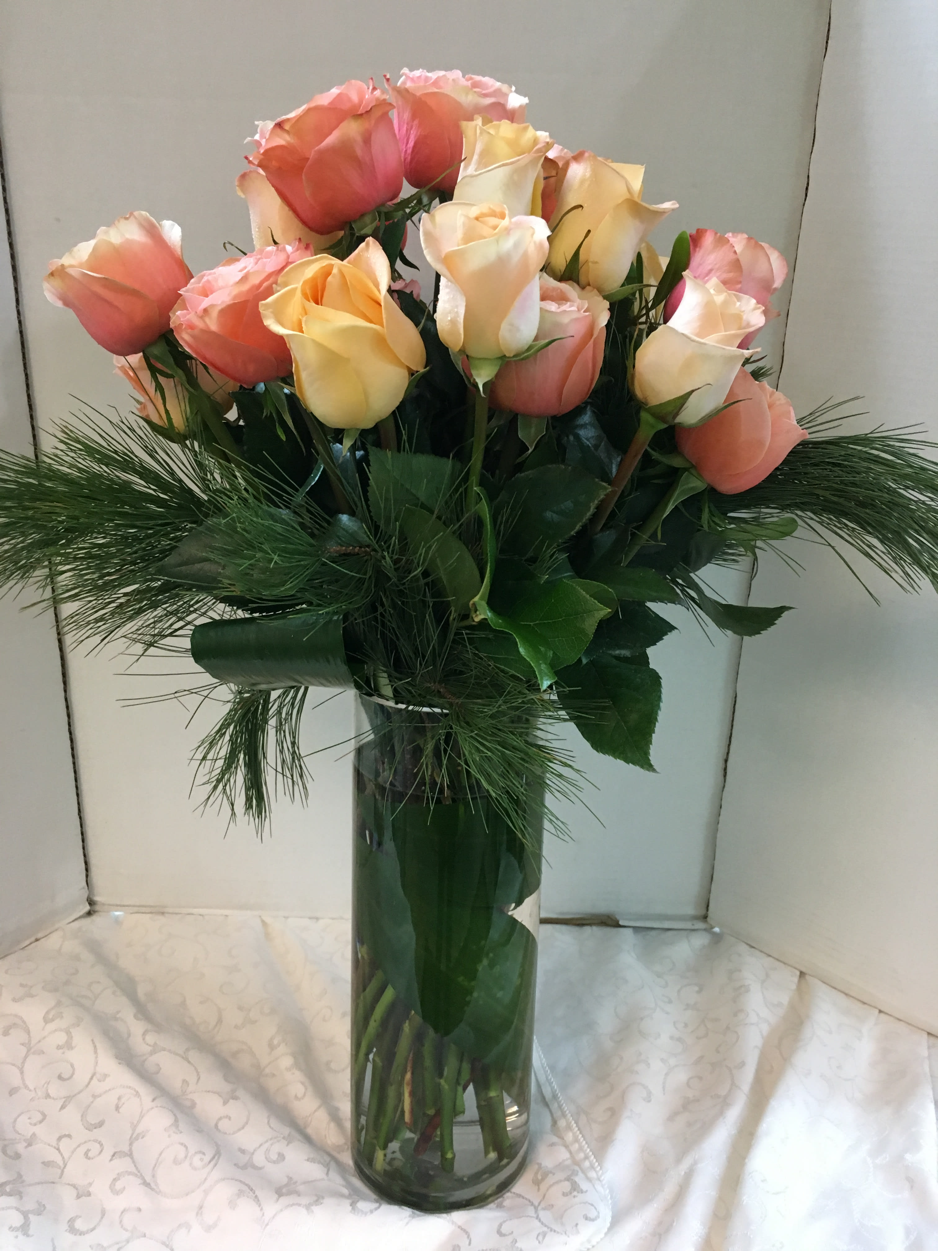  Assorted Rose Arrangement - Fancy  Greens (Picture is Deluxe) - COLOR OF ROSES  MAYBE DIFFERENT  FROM PICTURE.   PICTURE IS ONLY A DEMO PICTURE.   Assorted Roses &amp;  Assorted Fancy Holiday Greens.