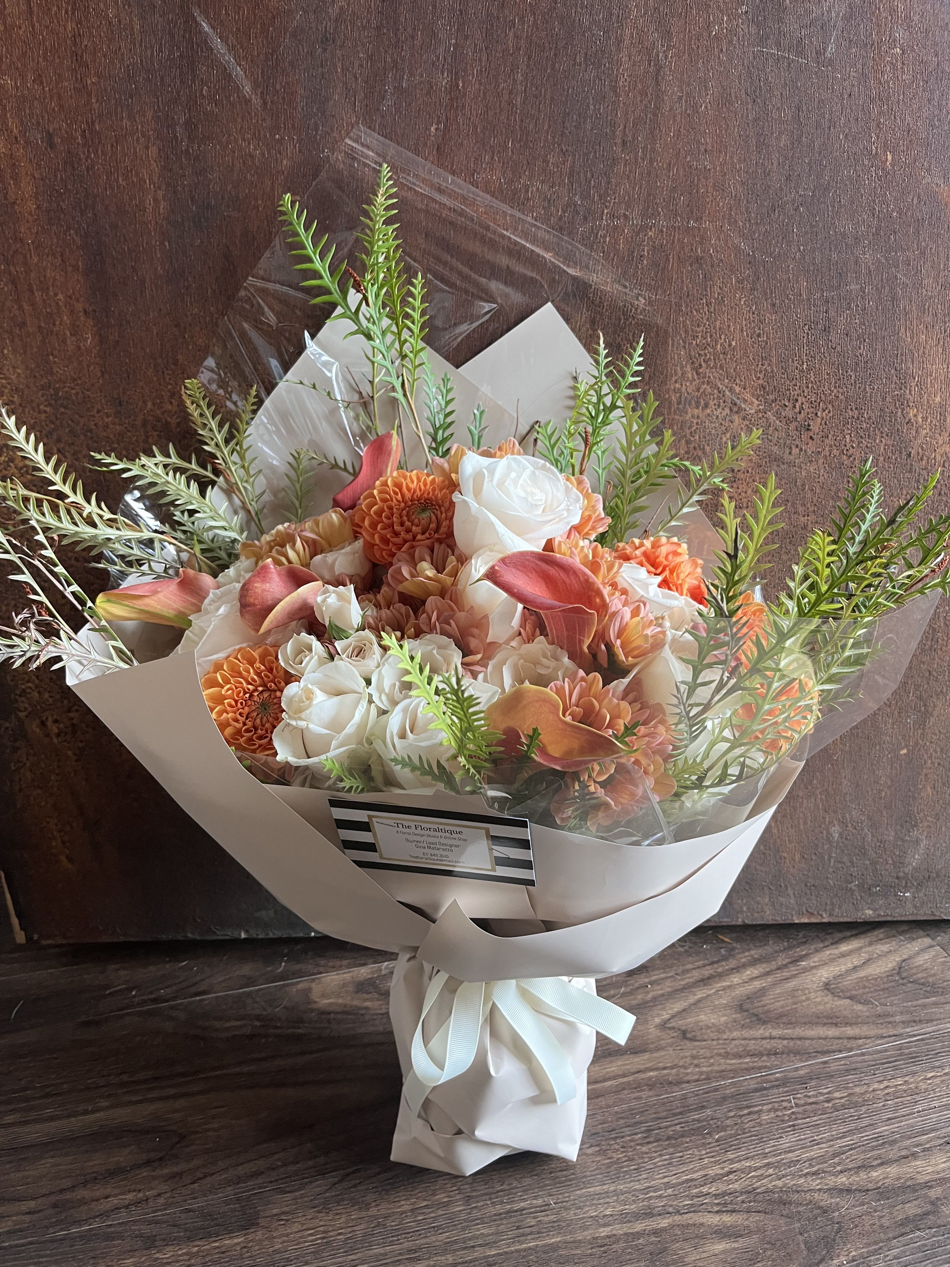 SUMMER DREAMSICLE BOUQUET - This hand wrapped bouquet full of summer’s best blooms in all shades of orange make the perfect gift for your special someone.  Perfect for all occasions! 