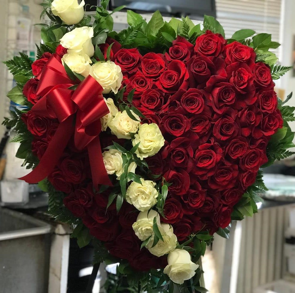 Rose Heart - A beautiful solid heart filled with roses. Perfect arrangement to show your love for a loved one who has passed on.