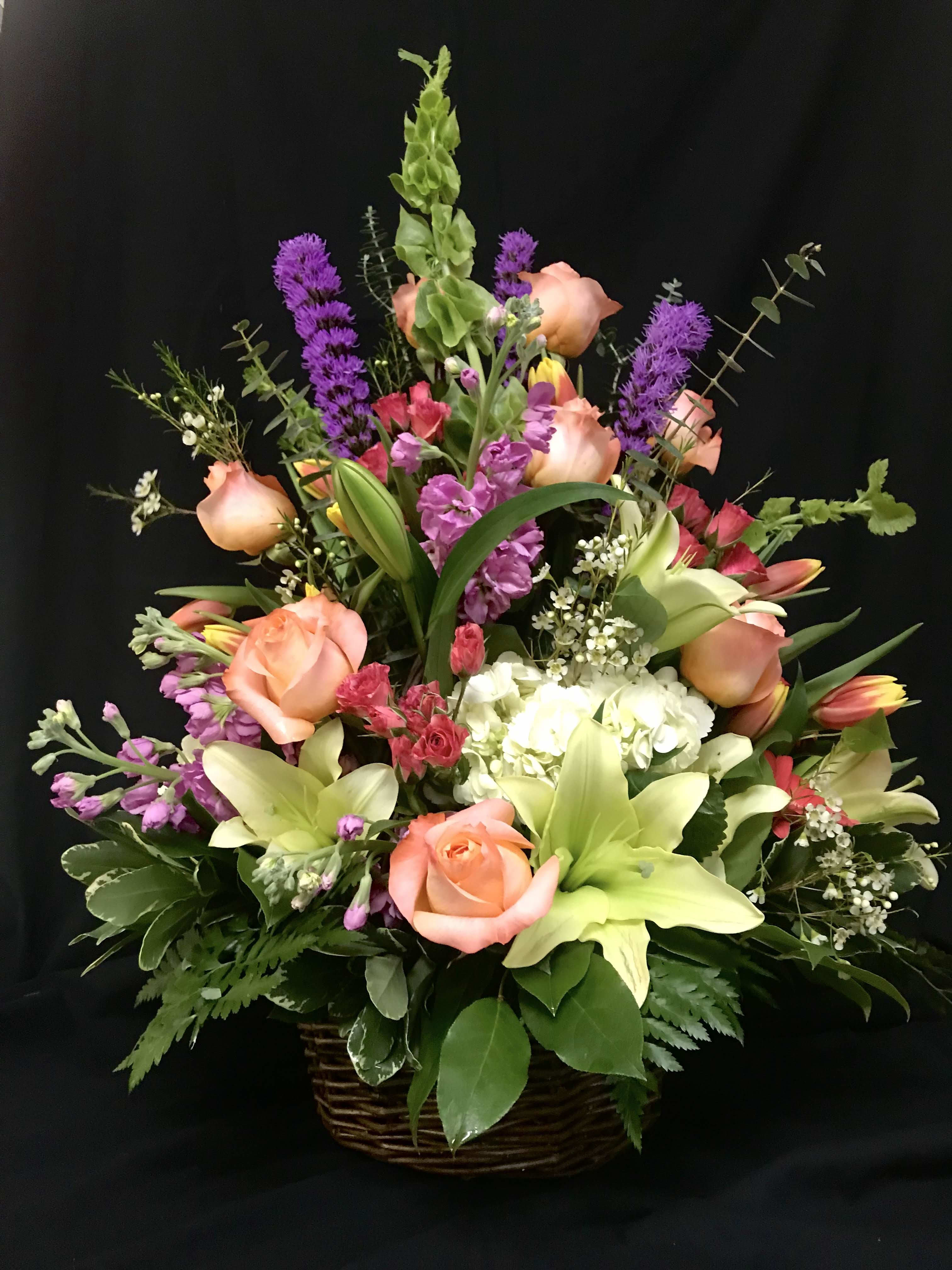 Spring Blossom Basket Spring Blossom Basket - Beautiful spring flowers arranged in a wicker basket. Good for everyday occasions or can be used for sympathy.