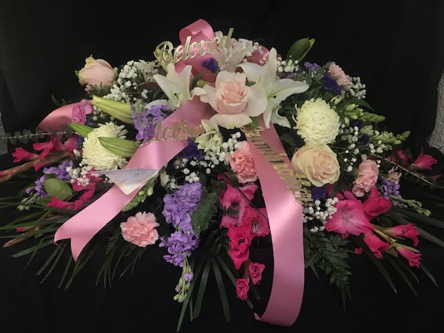 Sweet Dreams Casket Spray Sweet Dreams Casket Spray - A beautiful casket spray arranged with pinks, whites, purples and lavenders. Also can be paired with the Sweet Dreams Standing Spray, Sweet Dreams Corner Casket Piece, and the Sweet Dreams Wicker Basket.