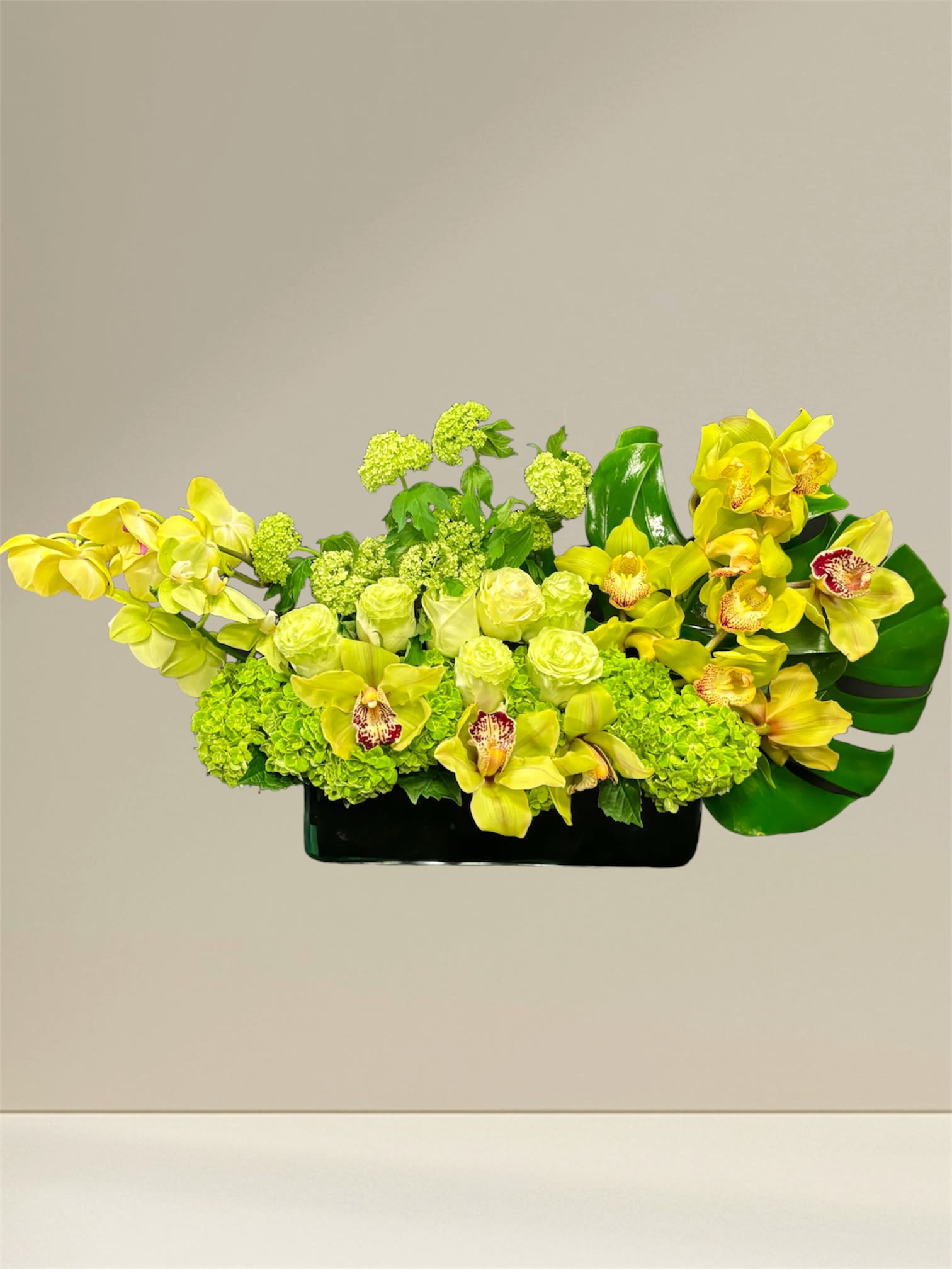 Bouquet Elegance - The refined bouquet with soft colors. Rich selection of green, beige and yellowish flowers, collected in an elegant composition. The shape of the bouquet is long, low and compact.