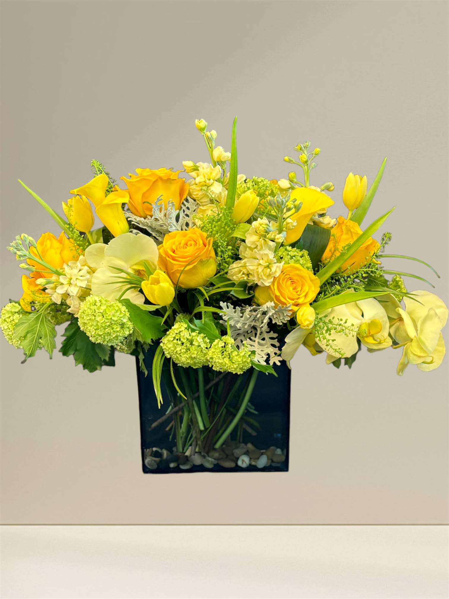 Sunny day Sunny day - Mixture of all yellow flowers in a W3 X L6 X H6 rectangular vase